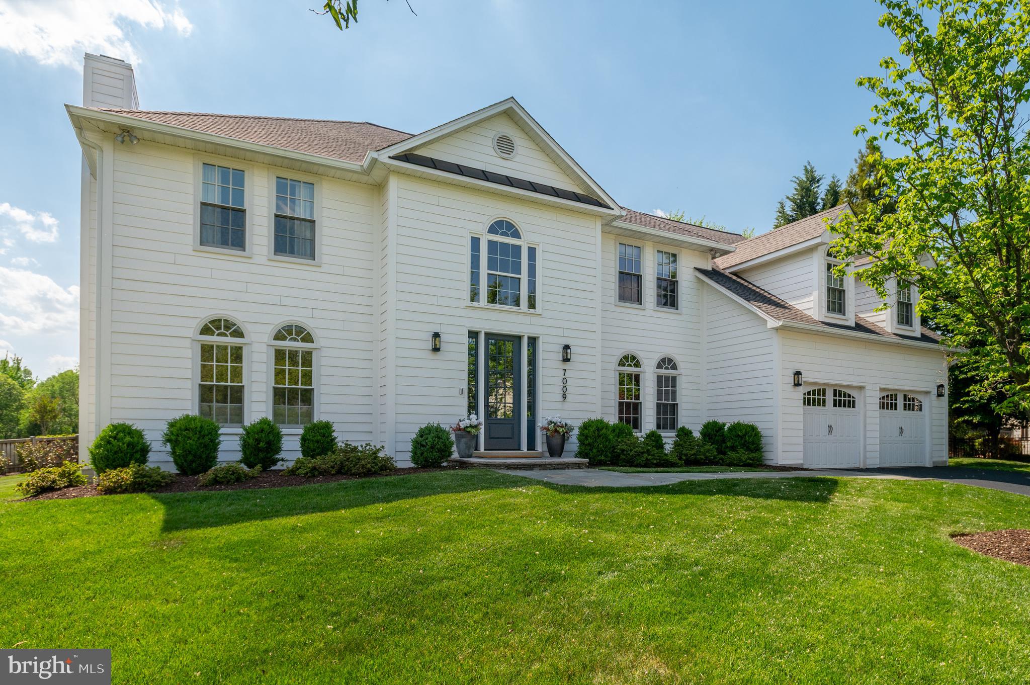 Fully turnkey with carefully planned renovations, working with top local designers and contractors to get it right. The result is 6,300+ finished square foot, 5BR/4.5BA stunner on a quiet cul-de-sac lot with southern exposure, inside the Beltway, minutes to downtown McLean.
The kitchen, designed by Lobkovich Kitchen Designs, is the kind you don't expect to find at this price point. A custom-color 48" BlueStar range with a hand-fabricated metal hood anchors the space. Subzero refrigerator, dual Miele dishwashers, a warming drawer, Waterstone faucets, custom cabinetry with beaded inset detailing, herringbone tile backsplash, a saxon wood island with hidden outlets, and a U-Line nugget ice maker (the Chick-fil-A kind). 
Beautifully transformed, Lobkovich-designed primary bathroom with custom cabinetry, Brizo and Kohler fixtures, quartz counter and surrounds, towel warmer, a 66" undermount soaking tub, a separate walk-in shower, and heated ceramic tile floors with two zones. The upper-level en suite bath, lower-level bath, and main-level powder room were also fully renovated by Lobkovich.
The home is built wide rather than deep, which means natural light moves through the main level all day. A two-story foyer leads to a living room with a gas fireplace framed by a classic white paneled surround and clean mantel. The formal dining room includes wainscoting and two large hidden storage closets.  The home office has built-ins and the sunroom flexes easily into a playroom, craft room, or second office. The family room, breakfast room, and sunroom run along the entire back of the home, each opening to the next, with unobstructed views of the private garden. Coffered ceiling, a wood-burning fireplace, and a custom built-in entertainment center anchor the family room. Hardwired in-ceiling speakers run throughout the main level.
Upstairs, the primary suite includes a sitting area, an oversized walk-in closet with custom systems, and a laundry chute that lands in a hamper in the bathroom (a small detail that turns out to matter). Three additional bedrooms share two full bathrooms: one en suite, one Jack and Jill. A second laundry room was added to this level. Hardwood floors throughout.
The lower level has a sunny bedroom, fully renovated Lobkovich bathroom, a recreation room with a wood-burning fireplace, and an exercise area with LVT flooring and custom mirrors. Plenty of unfinished storage space as well.
The garage is steps from the mudroom, walk-in pantry, and kitchen, making grocery runs genuinely painless. The garage includes a GarageTek storage system (accessories convey), a dedicated EV outlet, LED lighting, and replaced garage doors. 
Outside, professional landscape and hardscape design transformed the space with a 400 square foot patio with stacked stone retaining walls, boulder steps, fieldstone stepping stones, perennial plantings, and privacy screening with Green Giant Arborvitae along the rear border.  Also included is a 10-zone irrigation system, buried downspouts, and a dedicated gas line for the grill. 
The cul-de-sac is perfect for pickleball and other neighborhood activities. Lewinsville Park is steps away, McLean High School and the McLean Swim & Tennis Association are down the street, and the McLean Racquet and Health Club is nearby. Easy access to major commuter routes. Public water, public sewer.