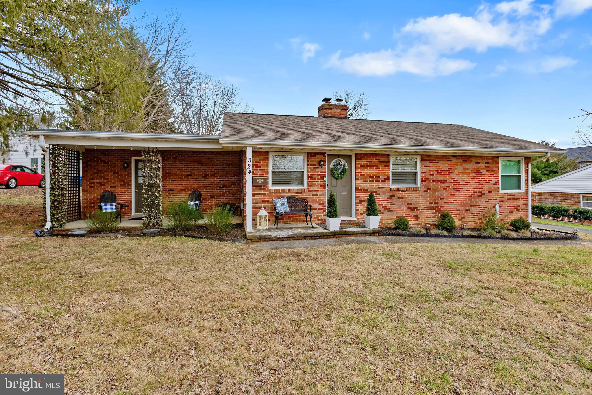 OFFER DEADLINE:  SUNDAY 1/12/2024 AT 4PM.
Welcome to this enchanting all-brick rambler, nestled on a substantial .44-acre lot in the charming town of Berryville, VA. This delightful 2-bedroom, 1-bathroom home is a testament to timeless beauty and modern convenience.

Stepping through the front door, you'll be greeted by the warm embrace of beautiful hardwood floors that extend seamlessly throughout the home. In the inviting living room and dining room area, a cozy wood-burning fireplace takes center stage, offering a perfect spot to gather around during colder evenings. Crown molding, chair rail, and wainscoting add a touch of sophistication, creating an atmosphere that exudes classic elegance.

The kitchen is a chef's dream, boasting fully updated features such as lovely quartz countertops and gleaming stainless steel appliances. Whether you're preparing a gourmet meal or enjoying a casual dinner, this kitchen is equipped to meet your every culinary need.

The family room is a true gem, with exposed brick walls, beamed ceilings, and the continuation of beautiful hardwood floors. A Dutch-door leads to the covered side porch, allowing you to effortlessly blend indoor and outdoor living. This cozy retreat is the ideal space to relax and take in the tranquility of the surroundings.

The bathroom exudes vintage charm, with charming wall tiles and fixtures that harken back to a bygone era, adding a touch of nostalgia and character.

Outside, you'll discover a wealth of options for enjoying the expansive .44-acre lot. Whether you choose to bask in the sun on the delightful covered side porch or unwind on the charming patio within the fully fenced backyard, you'll find the perfect setting for your outdoor activities. A convenient storage shed provides a secure spot for your outdoor toys and gardening equipment, ensuring everything stays organized and readily accessible.

This charming all-brick rambler seamlessly blends classic aesthetics with modern updates, creating a home that's as charming as it is comfortable. With its beautiful hardwood floors, cozy fireplace, updated kitchen, vintage bathroom, and inviting family room, this property offers a unique blend of character and functionality. Don't miss the chance to make this house your forever home – schedule a viewing today and experience the enchantment of this lovely abode in person.