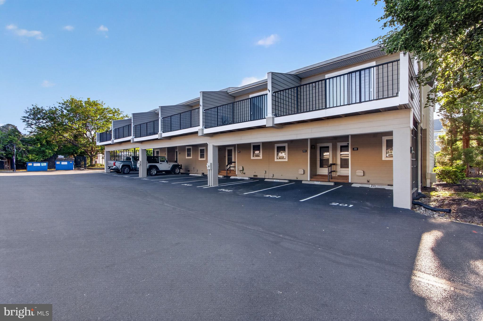 Beautifully updated Scarborough Village Unit in the heart of downtown Rehoboth Beach! This 2 Bedroom, 2.5 Bath townhome features an upgraded kitchen with quartz countertops, stainless steel appliances, and laminate wood flooring throughout both the first and second floors. Spacious living area with electric  fireplace conversion, first-floor powder room, and rear patio perfect for grilling and outdoor entertaining with landscaped privacy plus exterior storage closet for beach chairs and gear.  Spiral staircase leads to the second-floor offering two bedrooms and two full bathrooms, plus a laundry room. Community amenities include a saltwater pool and unbeatable location just over 3 blocks to the beach and boardwalk, with direct gated access to Rehoboth Avenue. Never rented, but offers excellent rental potential if desired.