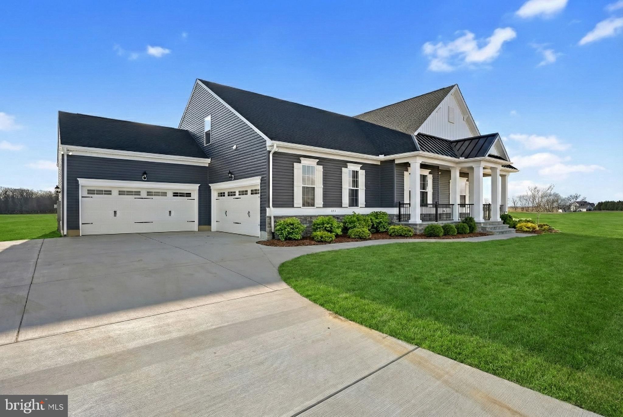 Welcome to 404 Wiggins Mill Rd, a stunning luxury single-family home in Townsend, DE, offering an impressive 4,431 square feet of living space. This detached residence boasts five spacious bedrooms and four and a half bathrooms, providing ample room for comfort and privacy.

Step inside to discover elegant architectural elements, including crown moulding, wainscoting and high ceilings, complemented by sleek vinyl floors and recessed lighting throughout. The gourmet kitchen is a chef's dream, featuring stainless steel appliances, a gas stove, wall oven, range hood, and a large kitchen island with an oversized pantry. The open layout seamlessly connects the kitchen to the living areas, making it perfect for entertaining.

Relax in the cozy living room with a working fireplace, or retreat to the primary ensuite, which offers a soaking tub with separate vanities. Additional features include a home office, screened in back porch, and finished basement, ensuring versatile spaces for work and play.

The home features a finished basement perfect for entertaining, while still providing ample storage space. Enjoy the convenience of a laundry room with washer/dryer hookup and the practicality of an attached garage.

Outdoor living is enhanced by a charming full front porch, perfect for unwinding and enjoying the serene surroundings. With forced air heating and air conditioning, this home ensures year-round comfort. Experience luxury living at its finest in this exquisite Townsend residence.