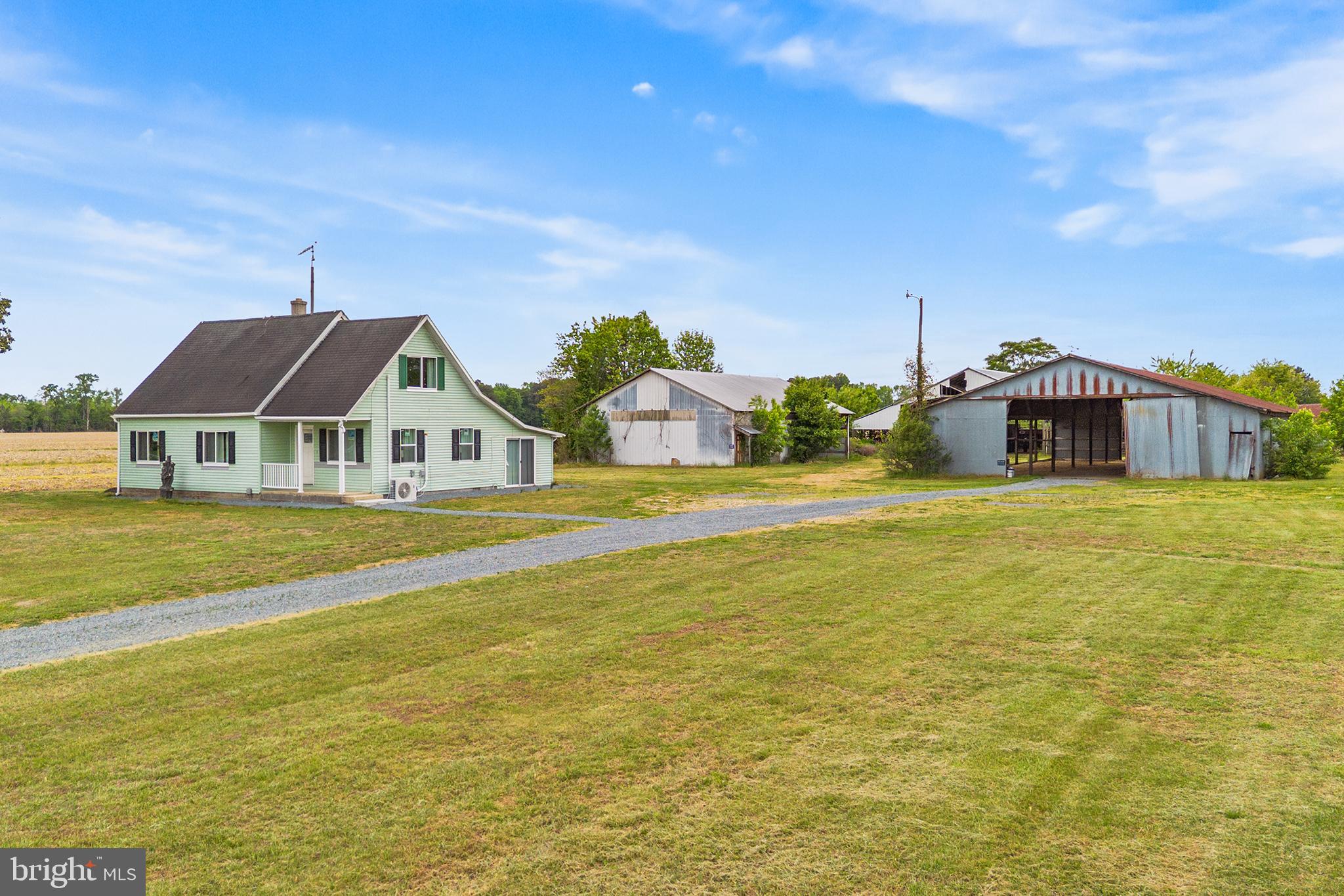 Opportunity to purchase this remodeled residence situated on over 18 acres.  Improements include new luxury vinyl plank flooring and Advantech subfloors to a fully replaced middle beam for lasting structural integrity. Nearly all windows and doors are brand new, the heating system has been upgraded to an efficient heat pump, and the electrical system now features a 200-amp panel, a dedicated service line from Choptank Electric, and brand-new fiber optic internet. New appliances! The ceilings have been completely redone with fresh drywall and stylish modern lighting fixtures throughout. Both bathrooms are fully remodeled, with one converted into an attached en suite. The entire interior has been freshly painted. The kitchen features stainless appliances, including a refrigerator, stove, garbage disposal, and chimney hood. The back side of the roof has been replaced with top-quality plywood. Outdoor improvements include complete removal of trees and stumps for a cleaner, more open landscape. Enjoy the private setting or grow crops.  Room for livestock. Out buildings and main residence are being sold strictly AS IS. Excellent location with proximity to Delaware, Easton, and the Bay Bridge, this unique property combines rural charm with easy access to beaches, shopping, and commuter routes. A rare opportunity to own a fully renovated, income-generating estate—schedule your tour today!