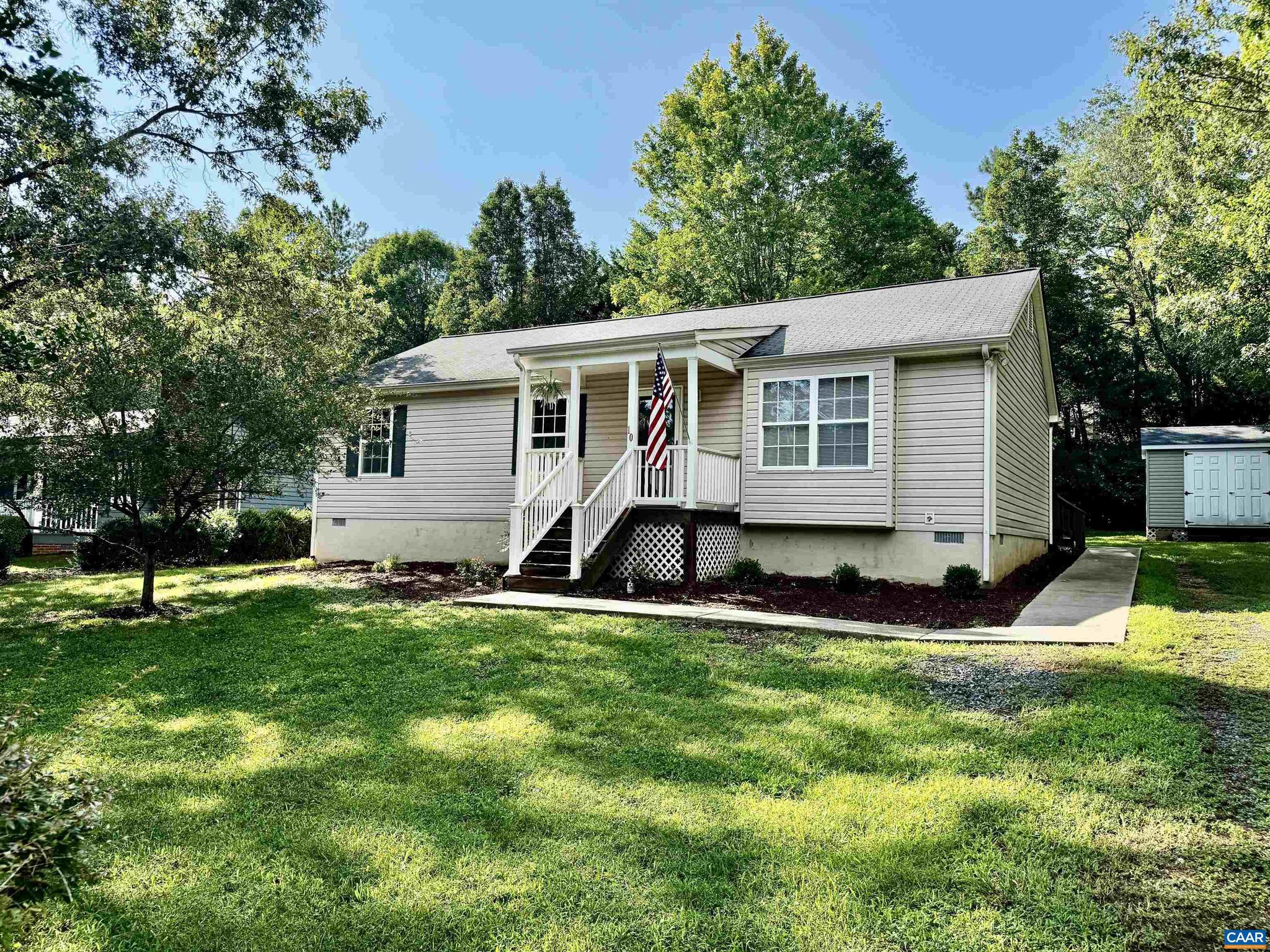 PRICE IMPROVEMENT. Bright & Cozy One-Level Home in Lake Monticello Discover easy living in this move-in ready 3BR/2BA ranch on a quiet, tree-lined street inside Lake Monticello?s sought-after gated community. Enjoy sun-filled rooms, an open, functional layout, and a large back deck perfect for relaxing or entertaining. The yard is beautifully landscaped with mature shade trees, plus an updated front porch, back deck ramp, and fresh power wash. A large storage shed adds convenience. Close to beaches, golf, and all of Lake Monticello?s amenities!,Wood Cabinets