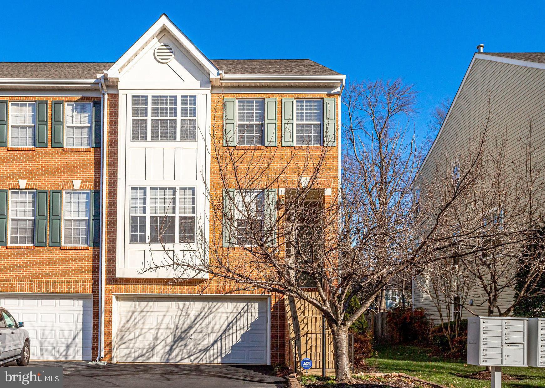 End unit brick townhouse with over 2,500sq ft  is ready for you to call home. Front stairs take  you into the main level with an open layout, hardwood floors and great natural light. Get cooking in the gourmet kitchen with stainless appliances, gas cooking and center island with breakfast bar. The kitchen is open to the family room with a gas fireplace to keep you cozy. Sliding doors take you out to the deck for views of the trees and room for dining al fresco. Moving upstairs you will find 3 bedrooms all with hardwood floors including the primary suite. Relax the day away in the primary suite with 2 walk-in closets, vaulted ceiling and ensuite bathroom featuring dual sink vanity, soaking tub and walk-in shower. An additional full bathroom and laundry room is conveniently located on the upper level as well. Plan for movie and game nights in the finished lower level with spacious rec room, full bathroom and access to the 2-car garage. You can also access the backyard with brick patio for more outdoor entertaining space. The home feels private as it backs to trees. Convenient to Reston Town Center, Reston Hospital, Fairfax Cty Pkw, Dulles Toll Road and Dulles Airport. Pets are case by case with $1000 deposit and $100 monthly pet rent. 2 year lease available.