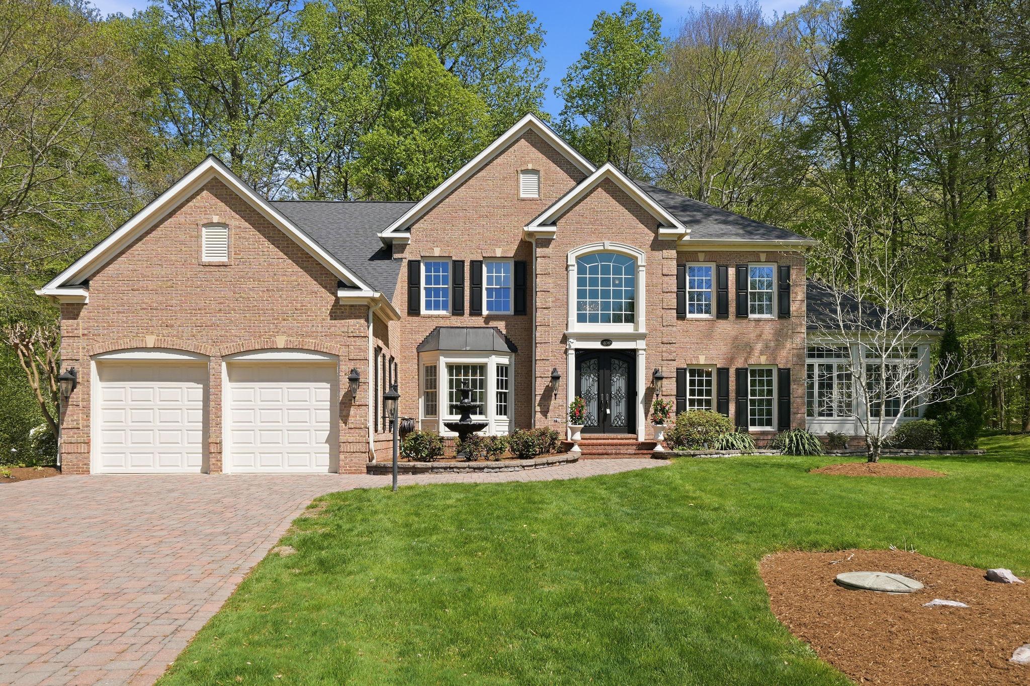 Welcome to 206 May Lane — a stunning brick colonial offering over 7,000 square feet of thoughtfully designed living space on a private, wooded lot in the sought-after community of South River Colony. From the moment you arrive, the home commands attention with its striking facade, sweeping paver driveway, and show-stopping solid iron entry doors that set the tone for everything inside.
The heart of the home is a newly renovated chef's kitchen that is nothing short of extraordinary — custom cabinetry, a dramatic quartz island, designer chandelier lighting, and an open flow into the family room make this a space buyers will never want to leave. The adjacent conservatory/sunroom is bathed in natural light with walls of windows overlooking the lush backyard and multi-tiered hardscaped patio — an entertainer's dream.
Upstairs, the primary suite is a true retreat. Spacious and serene, it features a sitting area, double-sided fireplace, and a fully renovated spa bath with heated floors, a freestanding soaking tub, frameless glass shower, and custom vanity. Four additional bedrooms, including a Jack and Jill bath and a private en suite, provide flexible living for every lifestyle. A dedicated home office and dual staircases round out the upper level.
The fully finished lower level is an experience unto itself — a recreation room, wine tasting room, home gym, second full kitchen with bar seating, a bonus flex room perfect for a playroom or additional office, and direct exterior access make this level as functional as it is impressive.
Outside, the multi-level hardscaped patio with built-in seating walls, fire pit area, and mature tree-lined backdrop creates a private outdoor sanctuary.
Fresh paint and new carpet throughout the second floor. Every detail has been considered — this one is truly move-in ready.
Nestled within the award-winning South River Colony, residents enjoy a lifestyle that is hard to match — approximately 300 acres of wooded preserves with walking trails, two pools, tennis courts, and playgrounds Southrivercolony, all just minutes from the community's own town center with shops, dining, and professional services. The Golf Club at South River is a private club with membership available to residents. Just six miles from historic Annapolis and 35 miles from Washington, D.C., the location is as compelling as the home itself.
This is the one you have been waiting for — where luxury, lifestyle, and location come together without compromise.