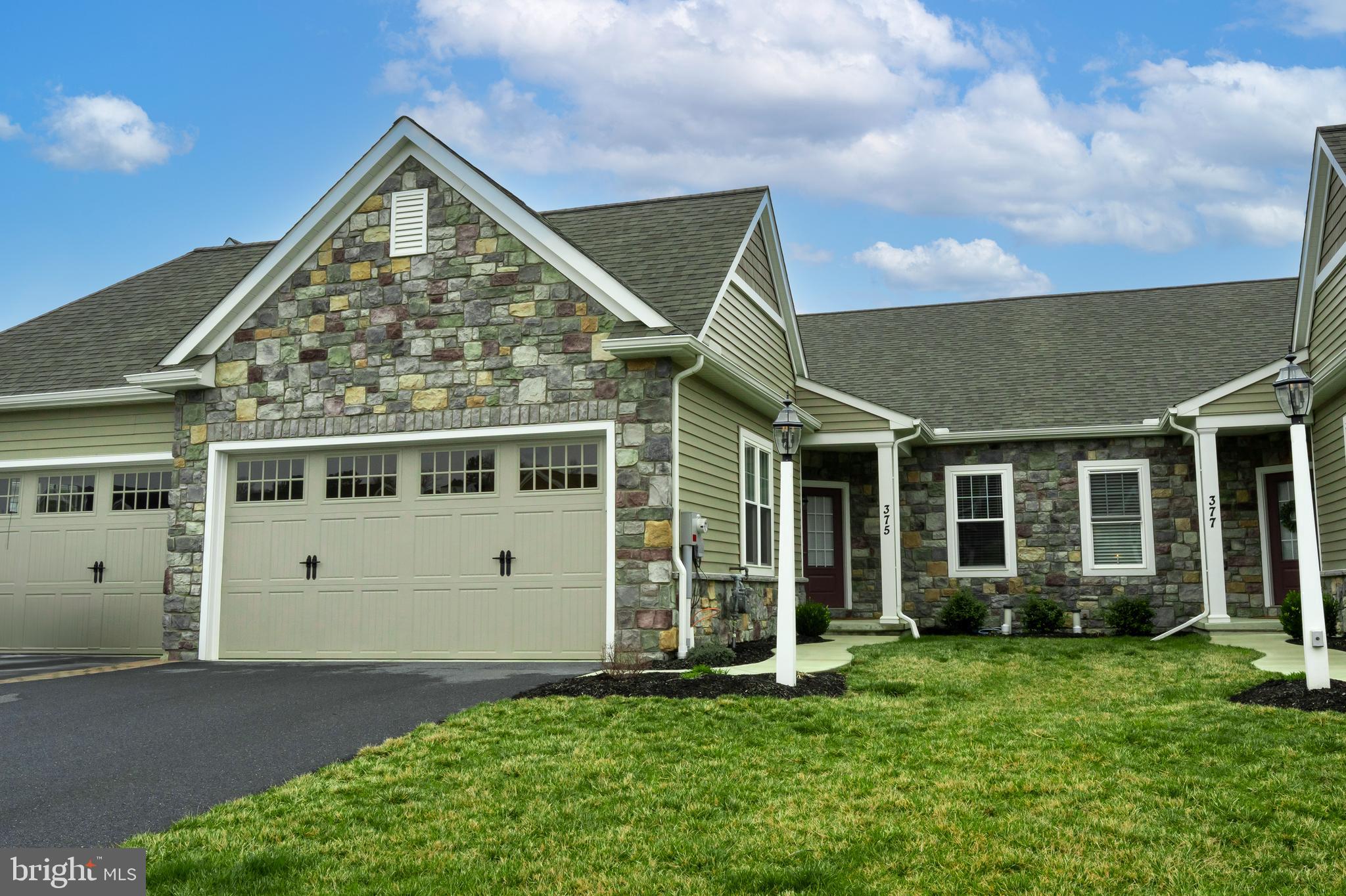 Welcome to this beautifully designed 2-bedroom, 2-bathroom semi-detached home in the desirable Lititz Reserve community. Featuring stone siding and hardwood floors throughout, this home offers convenient single-floor living with elegant touches at every turn. Step inside to a spacious living room, seamlessly connected to a gourmet kitchen complete with quartz countertops, a center island, pantry, and gas cooking—perfect for any home chef. Adjacent to the kitchen, the dining room provides an inviting space for entertaining. At the rear of the home, a bright and airy sunroom opens to a private back patio, ideal for relaxing outdoors. The primary suite is a true retreat, featuring an ensuite bath with double sinks, a walk-in shower, and a generous walk-in closet. A second bedroom (currently used as an office) and an additional full bathroom with a tub shower complete the main level. Need extra space? The fully finished basement boasts a bonus room, a large recreation area, and a dedicated home office. An oversized two-car garage offers ample storage. Situated just minutes from Downtown Lititz and Lancaster, this home combines style, comfort, and convenience. Schedule your private showing today!
