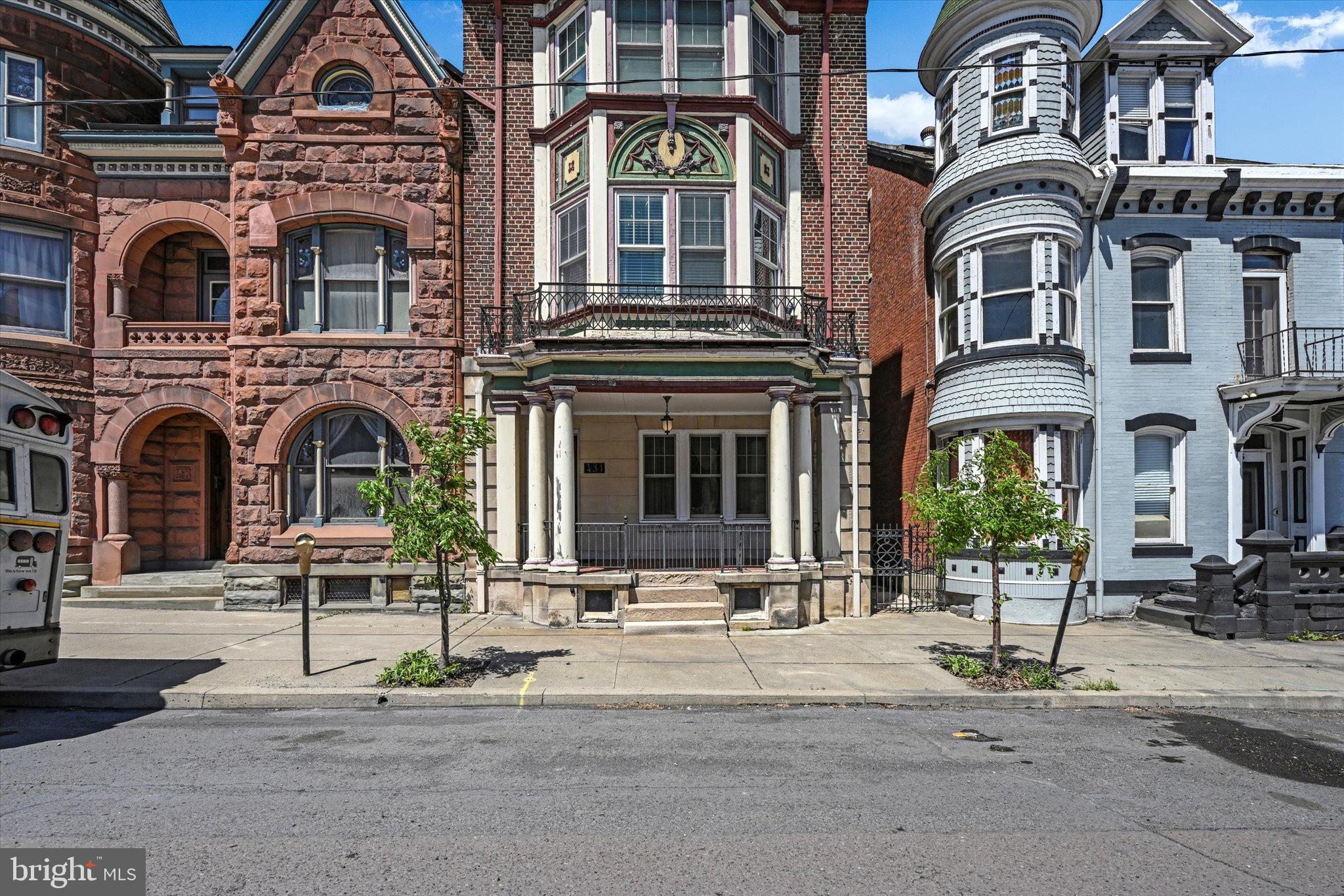 A rare opportunity to own a grand historic residence on Centre Street, offering timeless architectural detail, rich local history, and endless potential for investment, or unique residential living. With its expansive layout and flexible zoning potential, this property offers a wide range of possibilities beyond traditional residential use. Whether envisioned as a charming boutique Airbnb, an elegant bed & breakfast, a live-work office and residence, or even a multi-unit conversion (subject to local zoning approvals), the home presents a unique opportunity for buyers to tailor the space to fit their lifestyle or investment goals while capitalizing on its size, character, and prime Centre Street location. This stunning 1920s brick mansion, rich in history and timeless architectural elegance! Once owned by a former mayor of Ashland, this remarkable property offers a unique mixed-use opportunity, blending residential living with potential commercial use truly endless possibilities. A marble mosaic-tiled entryway welcomes you into a grand foyer adorned with striking beamed ceilings. The space opens into an impressive receiving room featuring a wood-burning fireplace and a dramatic three-story open stairwell. Pocket doors lead into a magnificent parlor, where high ceilings and intricate artisan plasterwork create a refined atmosphere. Throughout the main level, you’ll admire beautifully restored inlaid hardwood floors with rich, dark wood borders. The formal dining room is equally captivating, highlighted by a crystal chandelier and a large bay window with a charming cushioned window seat. This grand home features six generously sized bedrooms, each with large closets, along with two full tiled baths, a half bath on the main level, and an additional half bath on the third floor. The third level offers an exceptional bonus room surrounded by windows, accented with hardwood floors and an exposed brick wall. French doors provide separation from the open hallway, creating a versatile and inspiring space. A large walk-in cedar closet with custom built-ins currently used as an office adds even more functionality. Additional highlights include a full basement with upgraded mechanicals and a two-car brick garage with second-level storage.  Located in the historic town of Ashland, this home places you near unique cultural landmarks like the Whistler’s Mother Statue, engraved with a line from Samuel Taylor Coleridge: “A Mother Is the Holiest Thing Alive.” Enjoy nearby attractions including; Knoebels Amusement Resort – A top-rated, free-admission amusement park with over 60 rides, Pioneer Tunnel Coal Mine, Museum of Anthracite Mining, Famous Reading Outdoors – A premier destination for ATV and outdoor adventure enthusiasts. Outdoor lovers will also appreciate the nearby trails, including the scenic Big Mine Run Geyser. Additional Opportunity the seller is open to accepting Bitcoin, XRP, or Cronos as a portion of the purchase price. Conveniently located approximately 130 miles from New York City, 95 miles from Philadelphia, and 130 miles from Baltimore, with easy access to I-80, I-81, and Route 61. Don't miss this opportunity!