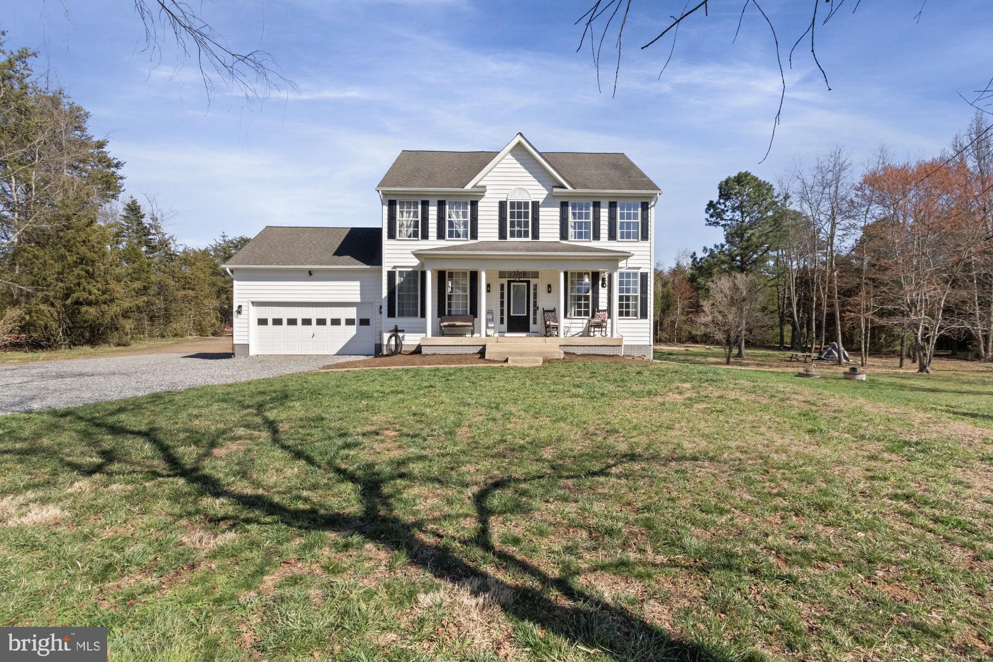 This stunning three-level colonial home is nestled on five acres of peaceful, private land. With a fenced yard, front porch, rear deck, gazebo, shed, and garden space, this property offers both serenity and practicality. Whether you're looking to entertain, unwind, or host family gatherings, there's a space for every occasion. The main level showcases an updated kitchen, dining room, breakfast nook, and a cozy family room, perfect for indoor living. After a long day, retreat to one of the three spacious bedrooms upstairs. The partially finished basement, complete with a bedroom &  full bathroom, offers versatile space ideal for guests, a home gym, office, or entertainment area. 
*Recent updates: flooring, paint, kitchen remodel, new stainless steel appliances, HVAC replaced in 2023*.