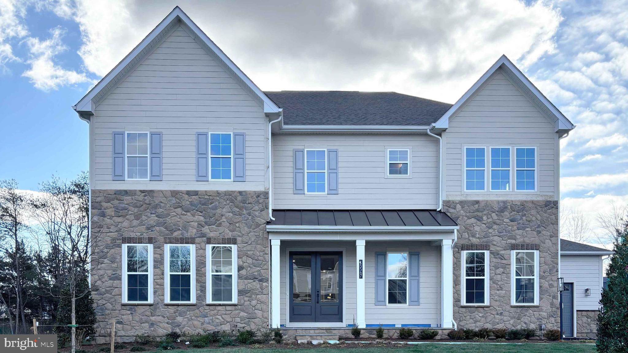 Designed with an extensive grand 2-story foyer, this home plan warmly greets your guests. Complete with dining, foyer, great room, primary bedroom & primary bath tray ceilings, the formal dining and flex room lead you to a spacious beamed ceiling great room, kitchen and first floor bedroom with full bath. The owners entry features built in cabinets and a private entry to the main level bedroom with ensuite full bath. All bedrooms have their own private baths and walk in closets.  The expansive Primary suite has dual walk in closets, sitting area and primary grand bath including a free-standing tub and spa-like shower. This design offers a finished recreation room and the basement bedroom and full bath are complete for your convenience. January Delivery.
Up to $10,000 total closing cost is tied to the use of DHI Mortgage.
*Photos, 3D tours, and videos are representative of plan only and may vary as built.*