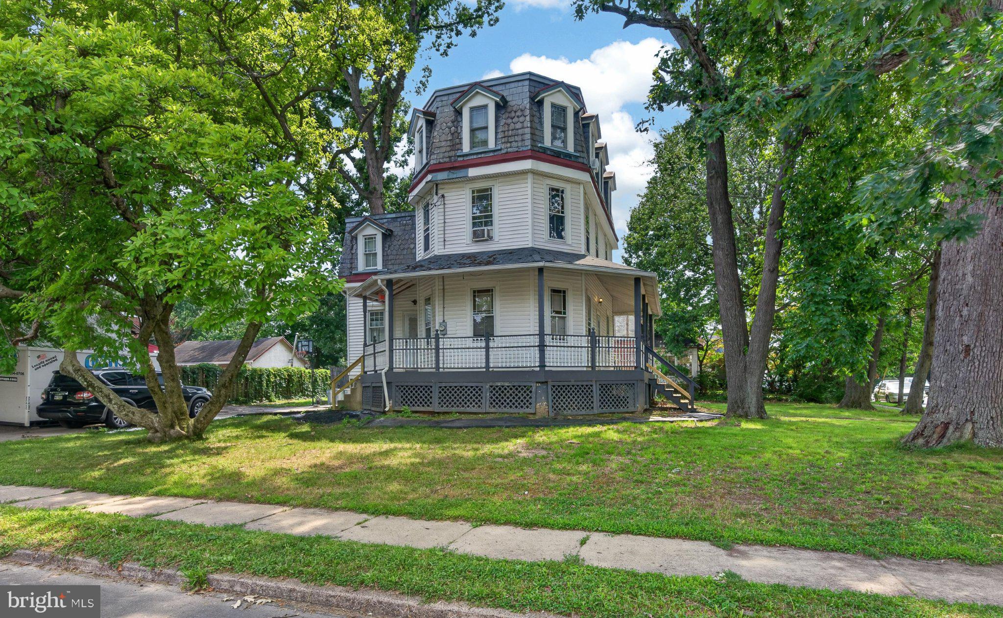 Nestled on a charming corner lot, this exquisite Victorian residence, built in 1910, seamlessly blends timeless elegance with modern comforts. Spanning 2,332 square feet, this home offers a warm and inviting atmosphere, perfect for creating cherished memories. Step inside to discover a thoughtfully designed traditional floor plan that features four spacious bedrooms and three well-appointed bathrooms. The heart of the home is the family room, conveniently located off the kitchen, where gatherings can flow effortlessly. The kitchen is a delight, boasting an island that invites casual dining and entertaining, complemented by a built-in range and single oven for all your cooking needs. Rich hardwood floors throughout add a touch of sophistication and warmth, enhancing the home's inviting ambiance. Ceiling fans throughout the home provide a gentle breeze, ensuring comfort year-round. An entry-level bedroom offers flexibility for guests or a private office space, catering to your lifestyle needs. The exterior of the property is equally impressive, featuring a delightful deck and porch that beckon you to enjoy the outdoors. The play area is perfect for leisure and recreation, while the corner lot provides ample space for gardening or outdoor gatherings. With an asphalt driveway and off-street parking for up to four vehicles, convenience is at your fingertips. Located in close proximity to public transportation, including a bus stop less than a mile away and a commuter rail station within 5 miles, this home offers easy access to the surrounding area. The neighborhood exudes a sense of community, making it an ideal setting for those seeking a peaceful yet connected lifestyle. This property is not just a house; it's a sanctuary where luxury meets comfort, offering an exclusive lifestyle that invites you to unwind and enjoy the finer things in life. Experience the perfect blend of historic charm and modern convenience in this stunning Victorian home.