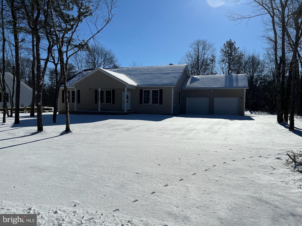 This new construction  ranch home located on a level, over one acre lot in Penn Forest Streams is the home everyone looking to buy. It offers 2000 square feet of finished living space , 2000 square feet of a basement that is insulated and has nine feet ceilings.  The two garage has 550 square feet of space.  All tolled the home has 4500 square feet of space.  Close to everything, yet far enough away!!!It features four bedrooms, two and a half baths, and the single floor living that everyone wants. Nine foot ceilings give the home an expansive feel! The basement has nine foot walls with bilko doors to the yard ,the garage has twelve foot ceilings and measures 24 x 24 feet.  A forced air propane furnace with central air conditioning and a fresh air intake system as well.  Set up with  security camera system and LED lighting the home offers all the modern amenities. The kitchen space has solid wood cabinets, beautifully accented granite countertops, an island, and a walk in  pantry space . Off the kitchen sits the dining space that opens to French doors and an expansive Trex deck overlooking the private backyard.   The rear of the home backs to municipal property offering added privacy.  A functional mudroom/laundry/halfbath space welcomes you in the side door off the garage.    The main bedroom is an ample space that has a seven by eleven walk in closet. The main bedroom bath has a double vanity, a glass door shower, and tile that will be pleasing to buyers.  The main bedroom is situated by itself on the left side of the house while the remaining three bedrooms are on the right. The living room is a large space that overlooks the covered front porch. The remaining three bedrooms have plenty of closet space and cable jacks on the wall.  Full basement. Set up your private showing today!!