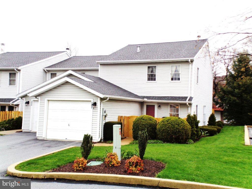 Adjacent to a park, offers a 1st floor bedroom, full bath & laundry, 2 patios-one with a privacy fence, oversized 1 car adjacent to overflow parking spots. Eat-in Kitchen with passthrough to formal dining area, LR opens to 2nd floor loft. Doors to rear patio, 2nd fl. huge BR with 2 walk-in  closets, 4 yr. old Trane furnace & central A/C, 5 year old Berber carpet, wood burning fireplace, convenient to Rt. 30 and I83, shopping and restaurants.