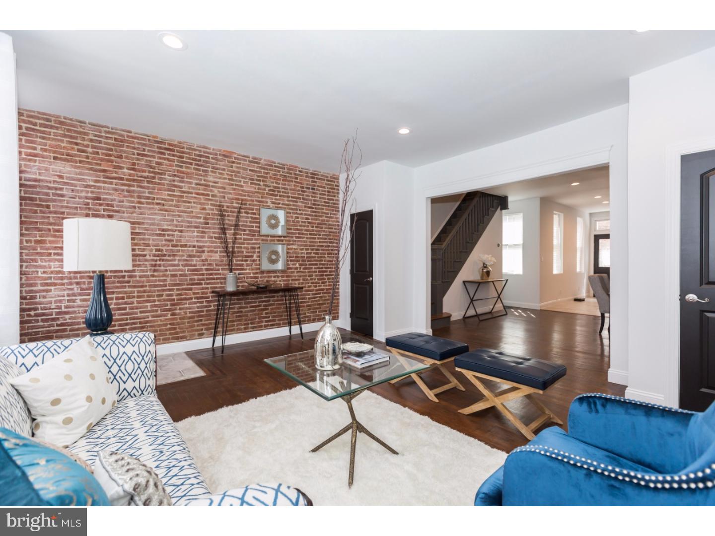 Unique 3-story, 101 yr old South Kensington home with many original features and modern touches. 4 bedrooms, 2.5 baths, dual zone NEST controlled smart technology HVAC, large private yard and huge rooms. Exposed brick in living room, a powder room and coat closet, original inlayed hardwoods on 1st floor, recessed lights on 1st floor, original wood staircase. New kitchen with full stainless appliance package, refrig with water feature, gas range, farmer sink, dimensional subway back splash, quartz counters, disposal and wine wrack. Large rear yard, huge cellar with exposed stone, exposed beams, laundry area and utilities. 2nd floor has original random plank rustic pine flooring, 2 enormous bedrooms, a French Country inspired bath with frameless shower, separate original claw foot tub, arabesque tile, linen storage, built in speakers blue tooth stereo and dual vanity sink with storage. 3rd floor has 2 bedrooms and a modern full bath with frameless glass enclosed shower and blue tooth stereo system.  Approximately 2250 sf plus a 972 sf basement. FIOS ready. We are flipping over this lovingly restored century old home in dynamic Old Kensington. Stateside on the block, Fishtown and El stop, all in walking distance, and minutes from town. Showings to being on Saturday 7/19.