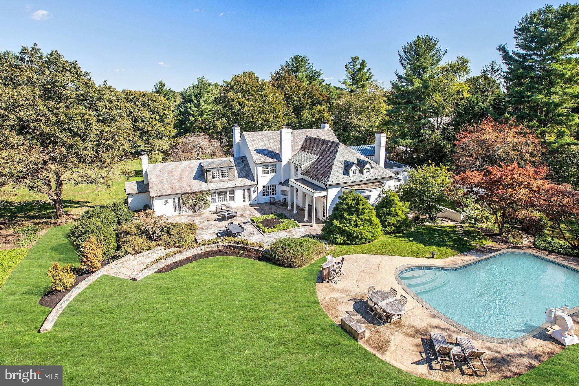 Incredible Gated Estate w/ 2.6+acres of lush landscaped privacy including Swimming Pool and Tennis Court!  Circular Driveway loops in front of the 8,900 SF home featuring 6 BR Suites, 7 Full + 2 Half Bathrooms, including a Main Level Master Suite w/ His & Her Baths and a Sauna. Fabulous floor plan perfect for entertaining with recent upgrades throughout. Bright open Kitchen, expansive patios, Wine Cellar, 6 Fireplaces (5 Indoor + 1 Outdoor), side-loading garage, too many details to list - Must See!