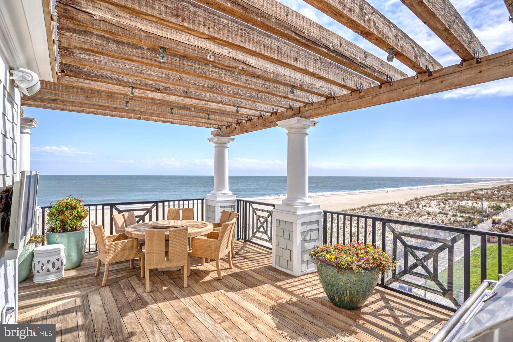 Rare Offering  - Oceanfront Luxury Penthouse in South Rehoboth!  Wrap around Ipe deck with grilling area, pergola, and sundeck all with panoramic views of the beach, ocean, and boardwalk.  Great room has built-in bar, fireplace, and marble floors with multiple sliding glass doors out to the deck.  The gourmet kitchen features two islands and high-end stainless appliances.  Spacious dining room is located next to the kitchen.  All four bedrooms have their own ensuite bathrooms and custom California closets.  The owner's suite has its own fireplace and two sets of french doors out to the deck.  There are two walk-in closets with California closets and owners' luxury bathroom with large tile shower, two vanities with sinks, and two private toilet rooms.  Entrance by elevator or stairs to 3rd floor. Private gated parking lot with two spaces.  Start living the South Rehoboth oceanfront dream!  Take the video tour!