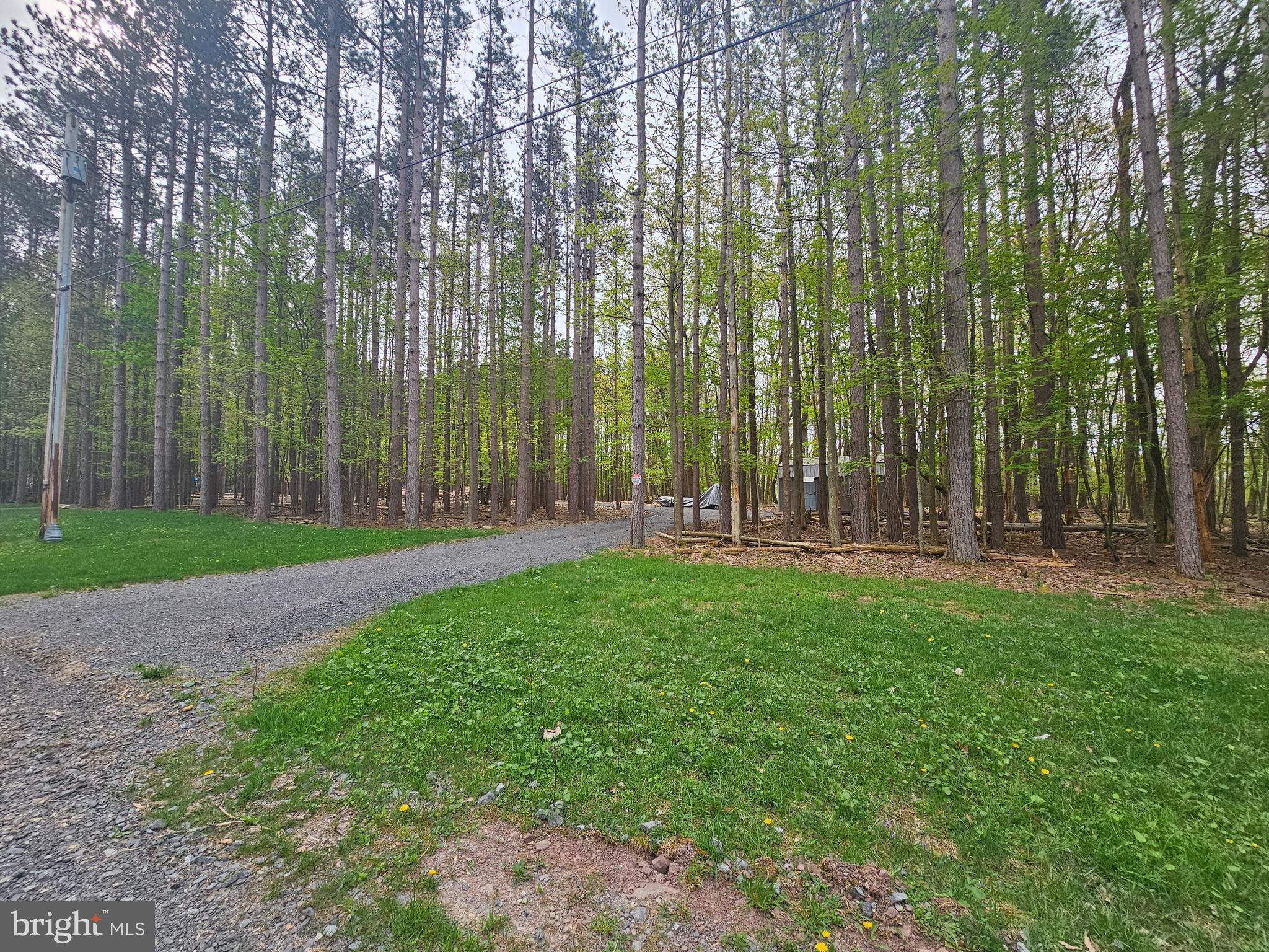 Looking for a lot around Deep Creek Lake but without any HOA fees and restrictions?  This is 3 lots together totaling 1.38 acres. It already has a well, electric and driveway in place. Did I mention it has a shed and has been perked for a five-bedroom home. Also it backs up to Gallatin Woods which offers extra privacy. There are so many possibilities!! Build your dream lake home!!