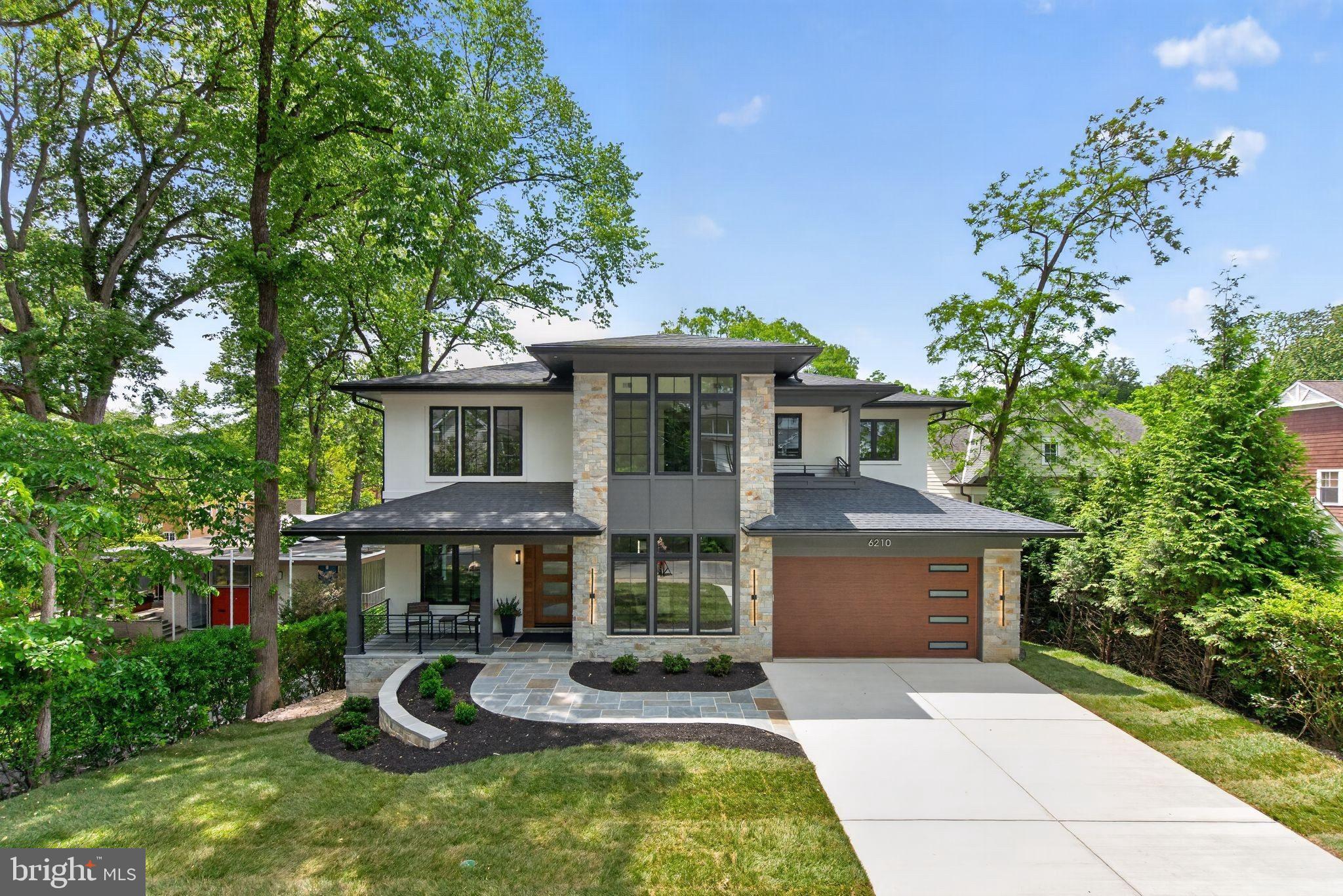 PREMIER FIRST OPEN: MAY 31 (2-4 PM) Come tour this 2026 Newly Built  8 BR / 7.5 BA custom modern dream home with stucco & stone exterior sited on 11,375 SF lot in coveted Glen Echo Heights neighborhood. Thoughtfully designed for the nature enthusiast, this home brings the outdoors in through sweeping balconies and expansive decks showcasing breathtaking treetop views. Meticulous high end designer finishes and amenities throughout including  10 FT ceiling on both the main floor and lower level and 9 FT ceiling on the upper level.  8 FT interior doors throughout.
Lower level is above ground with FULL DAYLIGHT and walk-out to rear deck overlooking large yard. 
Home features an open floor plan with Andersen casement & picture windows, white oak hardwood floors, modern staircase, and custom built-ins throughout.
Gourmet kitchen features large waterfall quartz island, 48" Wolf gas stove, 48" Subzero refrigerator, Bosch dishwasher and Zephyr wine fridge in butlers pantry. BONUS: Hidden 2ND Kitchen w/ 2nd fridge, sink and dishwasher plus cabinet storage! 
Spacious Dining room features dropped ceiling with accent lighting and linear chandelier. 
Both Breakfast room and Family room (w/ coffered ceiling & linear fireplace) opens to porch
In-Law suite (or office) with full bath on first floor. Mudroom with washer/dryer, sink and built-in bench with cubbies. Household room with built-in desk and library lighting. Primary Bedroom is a private oasis with a linear fireplace coffee bar and balcony with magnificent view.  Stunning Primary Bath with radiant heated floor, soaking tub and large shower w/ bench. Oversized fitted closets throughout.
Recreation room with built-ins, linear fireplace, custom bar with beverage fridge, dishwasher and wine closet. Generous backyard offers endless possibilities - whether for entertaining or the addition of a future pool or sports court.. SIMPLY GORGEOUS!!!!