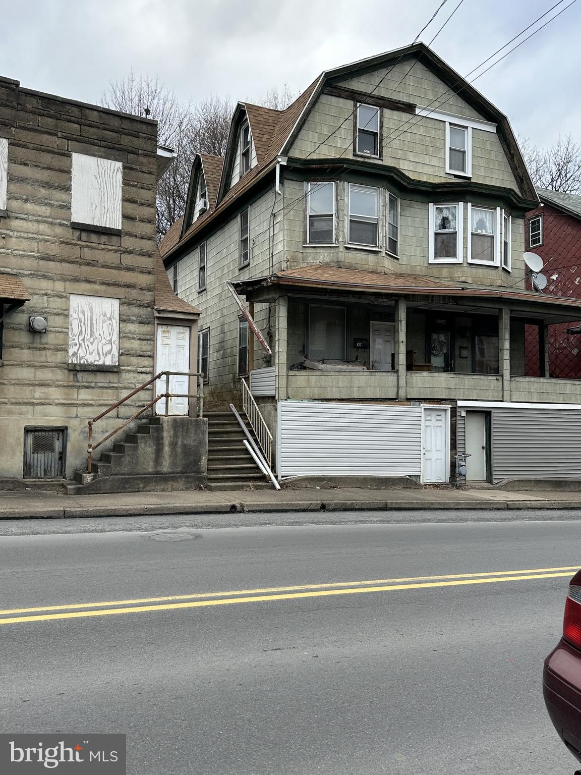 This property has so much potential! The home is nestled in the outer downtown area of Shamokin.  Spacious living area on the first level and original wooden floors throughout. The back door in the kitchen opens to a unique backyard, which can also be accessed from a side road leading to the back of the property, for off -street parking.  Two large bedrooms plus flex room on 2nd level, and three bedrooms on the 3rd floor.  Roof replaced in 2022. This large house is waiting for you to make it a home. Come check it out!