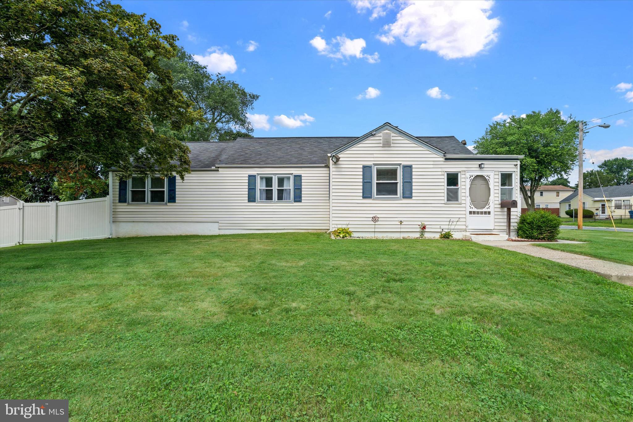 This is it! Situated on a spacious corner lot, this freshly painted single-level home offers flexible living space, an oversized garage with the interior space of a two-car garage, and a large fenced backyard. 
A bright, sun-filled enclosed porch creates a warm welcome and serves as a versatile foyer, mudroom, or sitting area while flowing seamlessly into the living and dining rooms. Hardwood floors can be found throughout much of the home, while the classic arched openings create an inviting flow between the main living spaces. Updated 200-amp electrical service and major systems provide peace of mind, knowing many of the important improvements have already been completed. The oversized garage features newer drywall, fresh paint, and a newly coated floor, making it an ideal space for parking, a workshop, hobbies, home projects, a home gym, or additional storage. Offering three bedrooms, the spacious rear bedroom addition features a generous walk-in cedar closet. Access to the rear bedroom is through one of the secondary bedrooms, providing a flexible layout that could also function as a home office, nursery, sitting room, or dressing area. Outside, enjoy a large fenced backyard with a wooden deck, plenty of room to relax or entertain, and two large storage sheds for all your lawn equipment and additional storage needs. Conveniently located near major roadways, shopping, restaurants, parks, and everyday amenities, this home is ready to welcome its next owner!

**Open House: Saturday, 11:00 AM - 1:00 PM**
