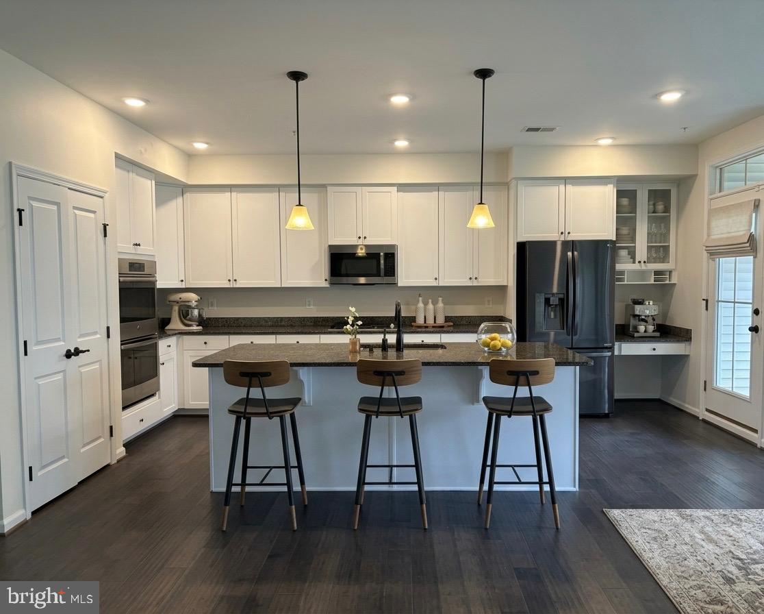 ✨ Stunning Upper-Level Townhome Condo in a Sought-After Community! ✨

Welcome to this beautifully maintained and move-in ready upper-level townhouse-style condo offering 2,600+ sq ft of stylish and comfortable living space! Featuring 3 spacious bedrooms, 2.5 baths, and a 1-car garage, this home perfectly combines elegance, convenience, and low-maintenance living.

Step inside to discover a bright and open floor plan with hardwood flooring throughout the entry and main living areas, soaring 9-foot ceilings, fresh designer paint, and brand-new carpet. The expansive living room is filled with natural light and enhanced with crown molding and recessed lighting, creating a warm and inviting atmosphere perfect for relaxing or entertaining.

The gourmet kitchen is a standout feature, showcasing granite countertops, stainless steel appliances, abundant cabinetry, and generous prep space—ideal for both everyday cooking and hosting guests. The adjoining dining area with crown molding adds an elegant touch for gatherings and family meals.

Retreat to the luxurious primary suite featuring a large bedroom, two walk-in closets, and a spacious en-suite bath with dual vanities. Additional bedrooms are generously sized, providing flexibility for guests, family, or a home office. Extra attic storage with flooring adds even more convenience.

Enjoy a truly carefree lifestyle in this quiet, beautifully maintained community offering exceptional amenities including:
✔ Resort-style pool
✔ Tennis courts
✔ Fitness center
✔ Scenic walking trails
✔ Exterior maintenance, snow removal & landscaping included

Located in the heart of Loudoun County, this home is just minutes from top-rated public schools, shopping, restaurants, entertainment, and public transportation.

🏡 A perfect blend of comfort, style, and convenience—this exceptional home is ready for you to move in and enjoy!
