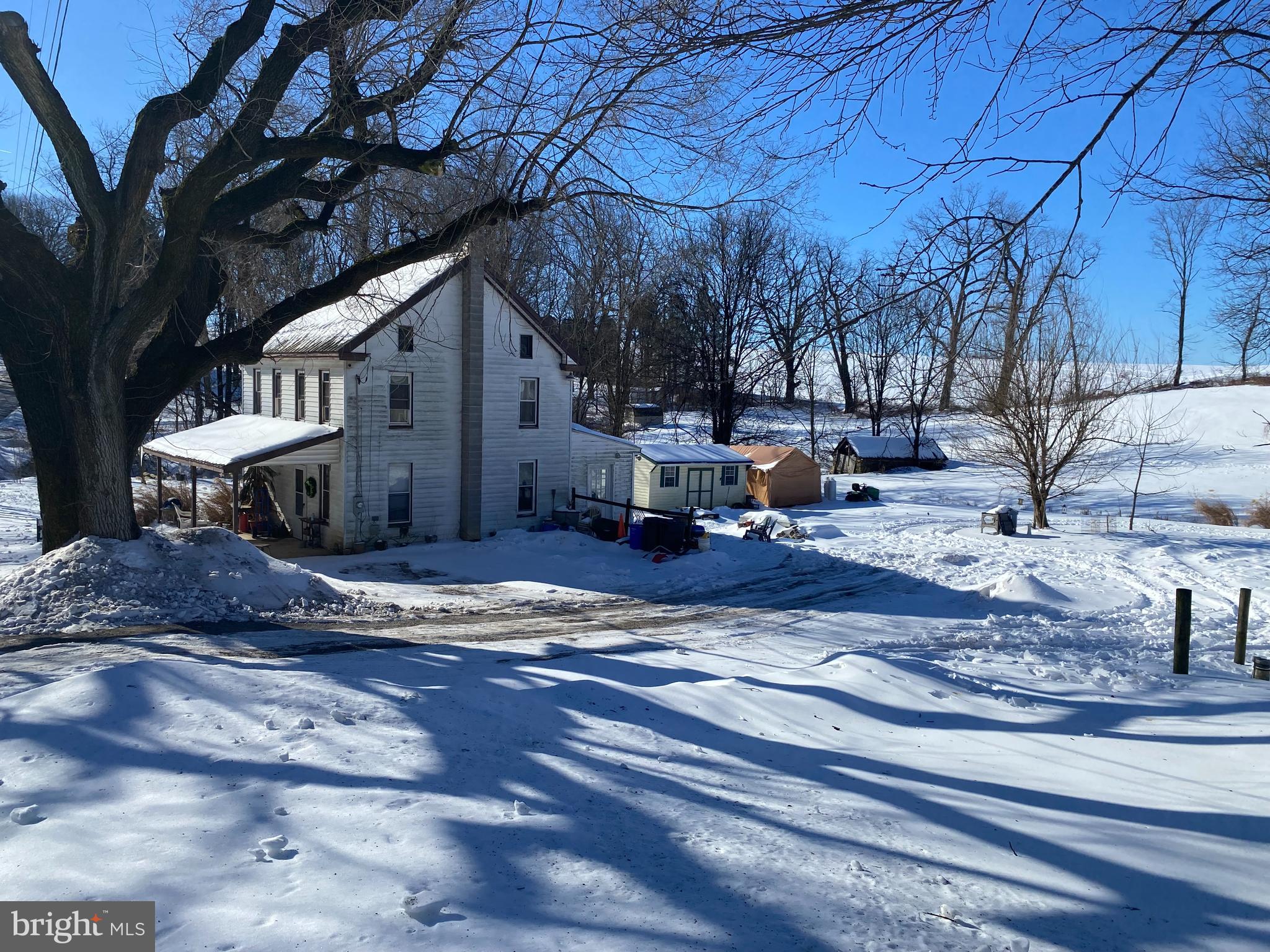 Own your own homestead and use the rental unit to supplement the mortgage. Property backs to a preserved farm, boasts a 6 acre mix of pasture, possible tillable land, and trees. There is also a spring and small stream.