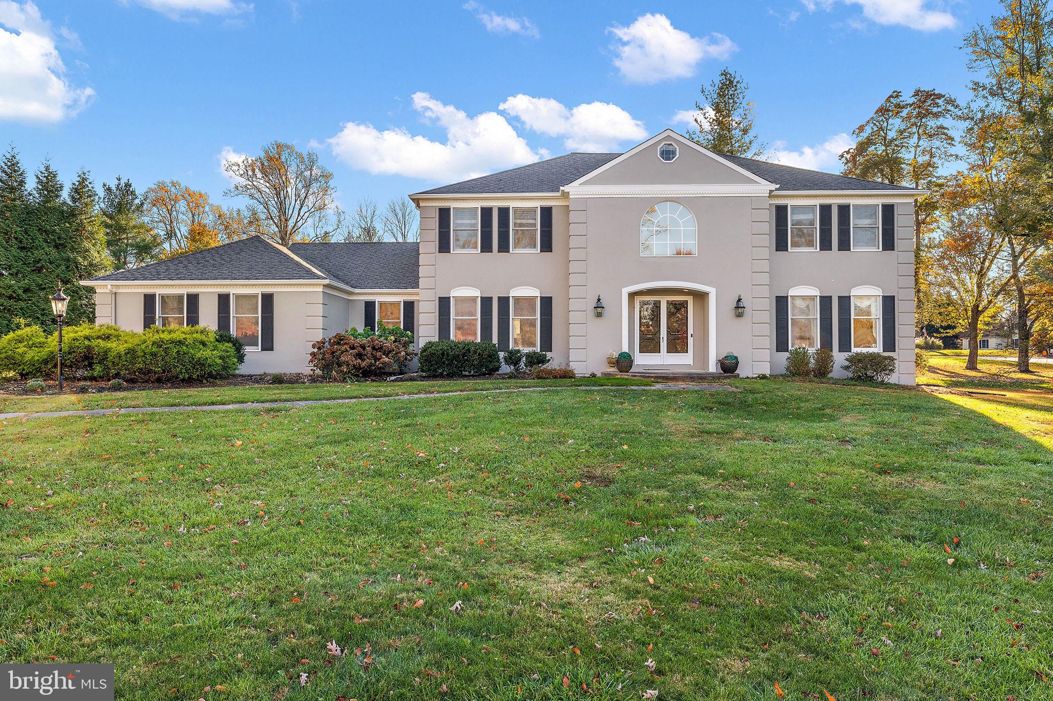 Welcome to 2 Roberts Road, nestled in a beautiful setting surrounded by trees and mature landscaping within an established neighborhood of custom-built homes. This grand French colonial residence boasts an exceptional floor plan with five bedrooms, centrally located in the heart of Newtown Square within the highly sought-after "Greene Countrie" community. Step into the welcoming center hall featuring a custom split staircase and gleaming hardwood floors. The newly renovated eat-in kitchen is a true delight, showcasing custom cabinets, a breathtaking granite center island, stainless steel appliances, tile backsplash, recessed lighting, hardwood floors, and a sunlit breakfast room. The inviting family room exudes comfort and charm, highlighted by a wood-burning brick fireplace, wet bar, and continued hardwood flooring. The generously sized living room, adorned with hardwood floors, is bathed in beautiful natural light. Adjacent to the kitchen is an elegant formal dining room, also featuring hardwood floors—a perfect setting for entertaining guests. A sunlit and airy sunroom addition boasts skylights, a ceiling fan, and French doors leading to the expansive deck and rear yard. Also on the first floor, discover a home office with built-in shelving, a renovated powder room, a separate laundry room, and a bedroom with a full bath—ideal for an in-law suite. The second floor offers four bedrooms, each with ample closet space. The spacious master bedroom includes a walk-in closet and a recently renovated master bath suite with a custom-tiled walk-in shower and a luxurious soaking tub. The oversized deck provides ample outdoor living space, creating a tranquil retreat for both entertaining and enjoying morning coffee. A partially finished basement, a two-car garage, and a beautifully landscaped level lot complete this architectural masterpiece. Meticulously cared for throughout the years, this home, with its cozy yet elegant design, stands as a testament to comfort and ideal location. Some of the recent upgrades include, new kitchen, new hall bath on the 2nd floor, new powder room, new heater, new hardwood flooring all in 2019. This custom-built residence holds a unique distinction as the builder's original home, crafted with meticulous attention to detail. Conveniently located near Episcopal Academy, Aronimink Golf Club, the new Ellis Preserve Shopping Center, restaurants, shopping, and the Main Line. Easy access to Philadelphia Airport, Rt. 202, Rt. 476, and the Turnpike enhances the appeal of this exceptional property.