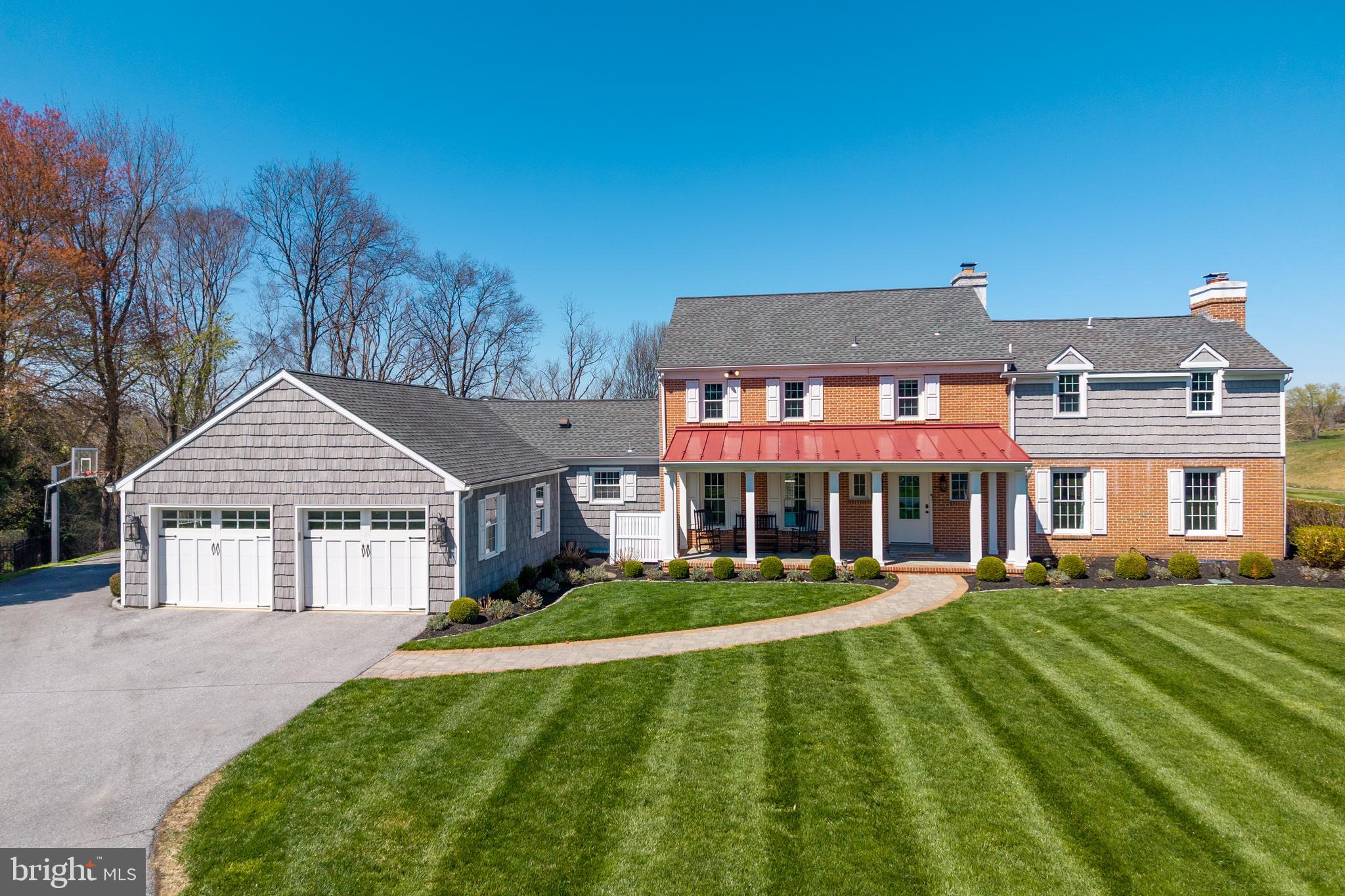 Positioned on 1.6 acres in Radley Run on a quiet cul-de-sac, 812 Hessian Circle in West Chester offers a rare combination of privacy, scale, and long views across Radley Run Country Club’s golf course and the Brandywine Creek. The home spans more than 5,500 square feet and has been extensively refreshed with newer windows, roof, and exterior siding, plus a freshly painted interior and added insulation in walls and ceilings with many more upgrades throughout.
At the heart of the main level, the open kitchen features granite countertops, a full slab island, custom cabinetry, and a farmhouse sink, flowing into generous gathering spaces. Entertain with ease using the butler’s pantry appointed with butcher-block countertop, wet bar, and beverage fridge. The first floor is rounded off with a spacious main-level great room that can be an optional bedroom with stunning views of the golf course, home office with custom built-ins and an attached new full bathroom, formal living room dining room, a family room that couples as a great playroom, and a mudroom with updated cabinetry and a folding station.
Upstairs, the fully reimagined primary suite delivers a spa-inspired bath with heated floors, a deep soaking tub, and a walk-through shower, plus a large open concept walk-in closet. There are 3 additional bedrooms with a hall bathroom and an a third attached bathroom in the 3rd bedroom.
The finished walkout lower level is designed for recreation and training with a play and fitness zone, a dedicated golf simulator room, and substantial storage. The basement also features a rear facing golf cart garage for additional storage and easy access to the course. Step outside to the expansive deck and an extensive lower hardscaped patio to take in the course-side setting overlooking the 17th hole. The garage comes equipped with a 220V hookup for EV charging.
Close to all major routes, Philadelphia, West Chester Boro, and Kennett Square.