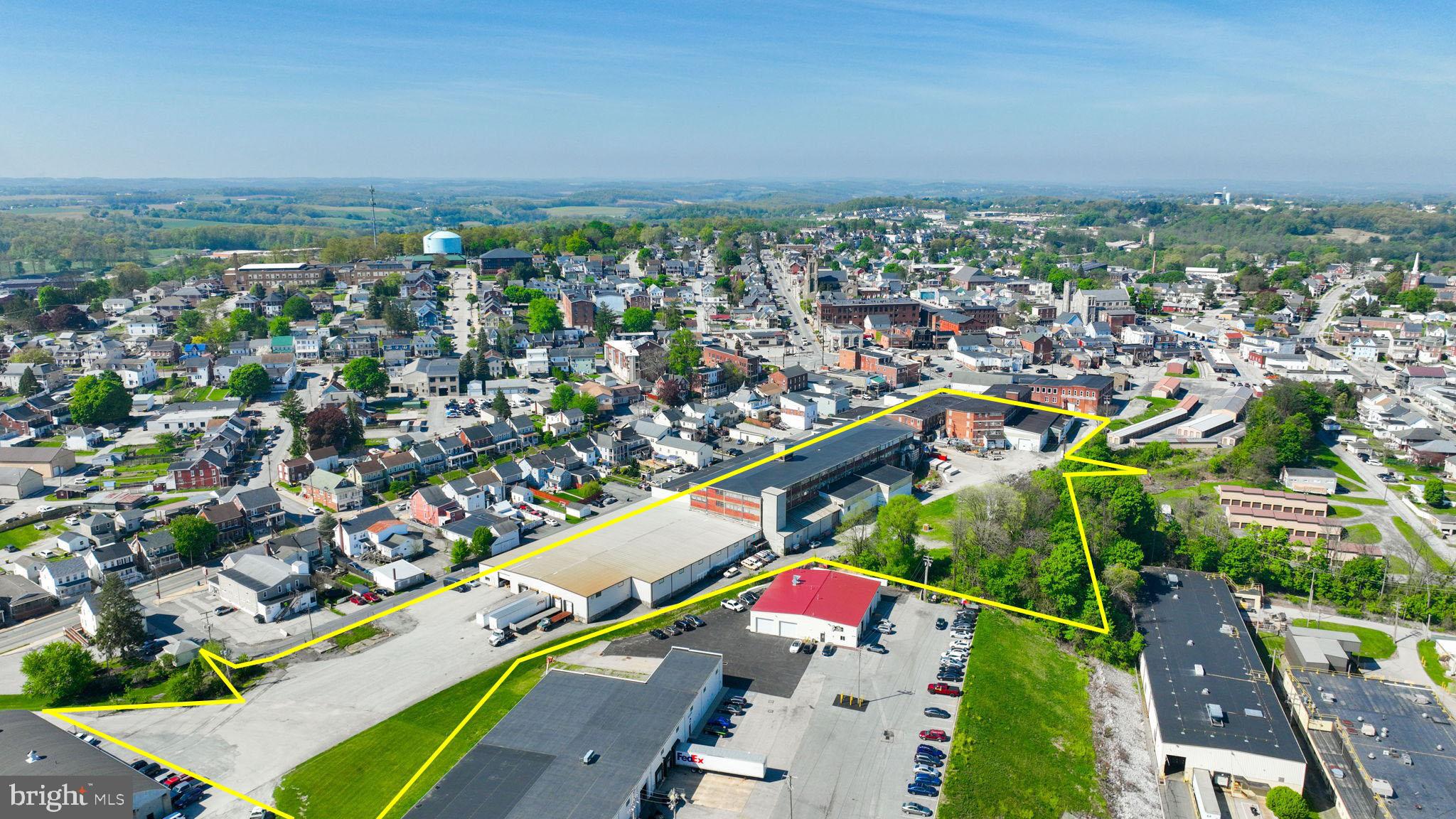 This industrial property in the Borough of Red Lion, York County, Pennsylvania, occupies a primary-site lot of 6.49 acres predominately level topography and paved road frontage.  The three-story building, constructed in stages during the early 1900’s, contains + 204,326 square feet of gross floor area and currently serves industrial/manufacturing/warehouse uses with public water, sewer, electric, and natural gas utilities available.  The site includes ample parking and multiple drive-in access points, providing access to the lower level, three (3) freight elevators, and the three main warehouse floors above. Seller is willing to leaseback a portion of the property, terms negotiable.