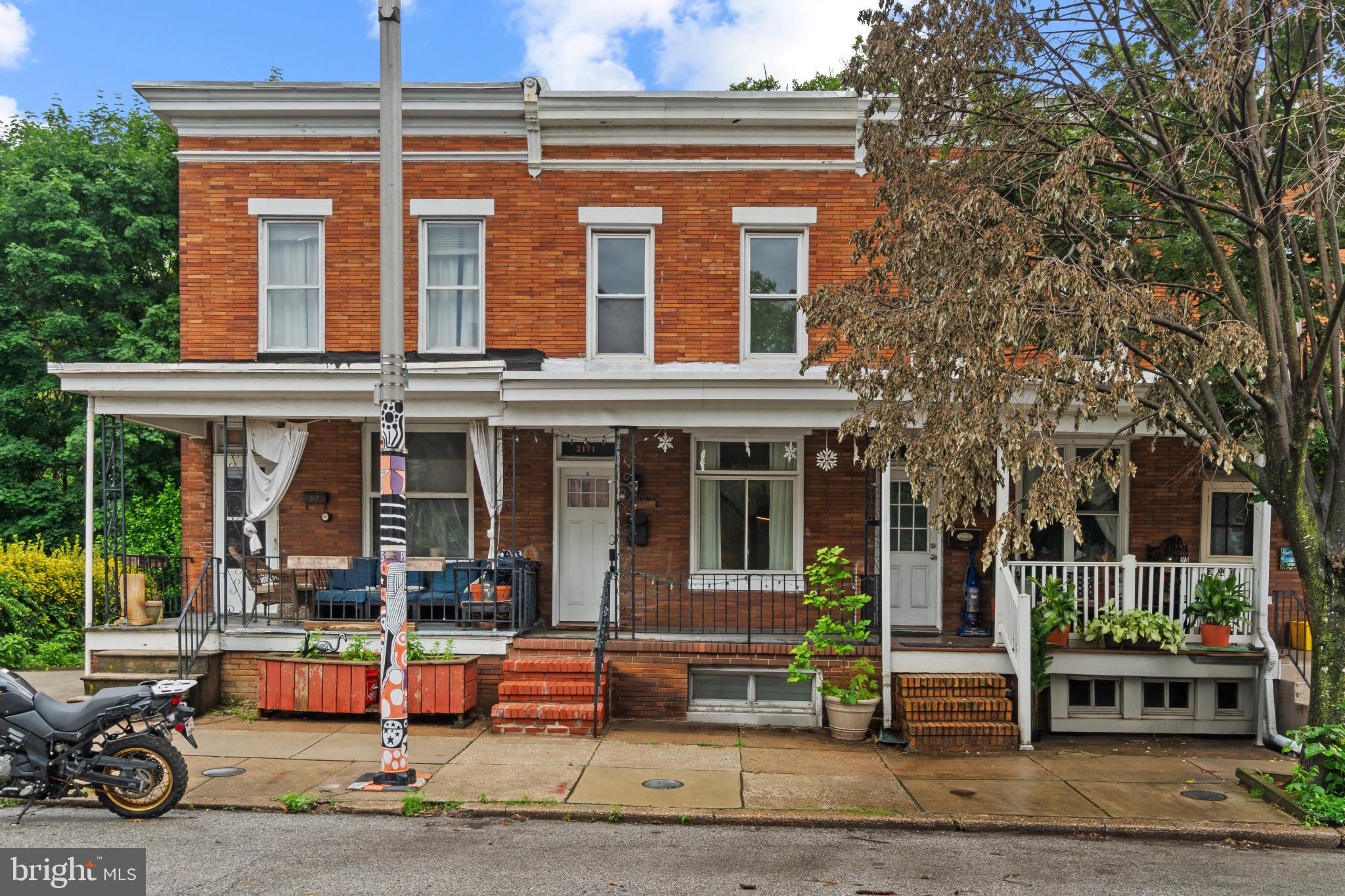 Welcome home to this charming 3-bedroom, 2-full-bath rowhome in the heart of Hampden. Featuring hardwood floors throughout, this home offers a warm and inviting feel from the moment you enter. The spacious eat-in kitchen is equipped with stainless steel appliances and provides plenty of room for cooking and gathering. Step outside to the screened-in patio just off the kitchen, perfect for relaxing or entertaining. The private, fully fenced backyard backs to woods, creating a peaceful retreat rarely found in the city. Conveniently located near Hampden's popular shops, restaurants, and amenities, this home combines comfort, character, and privacy.