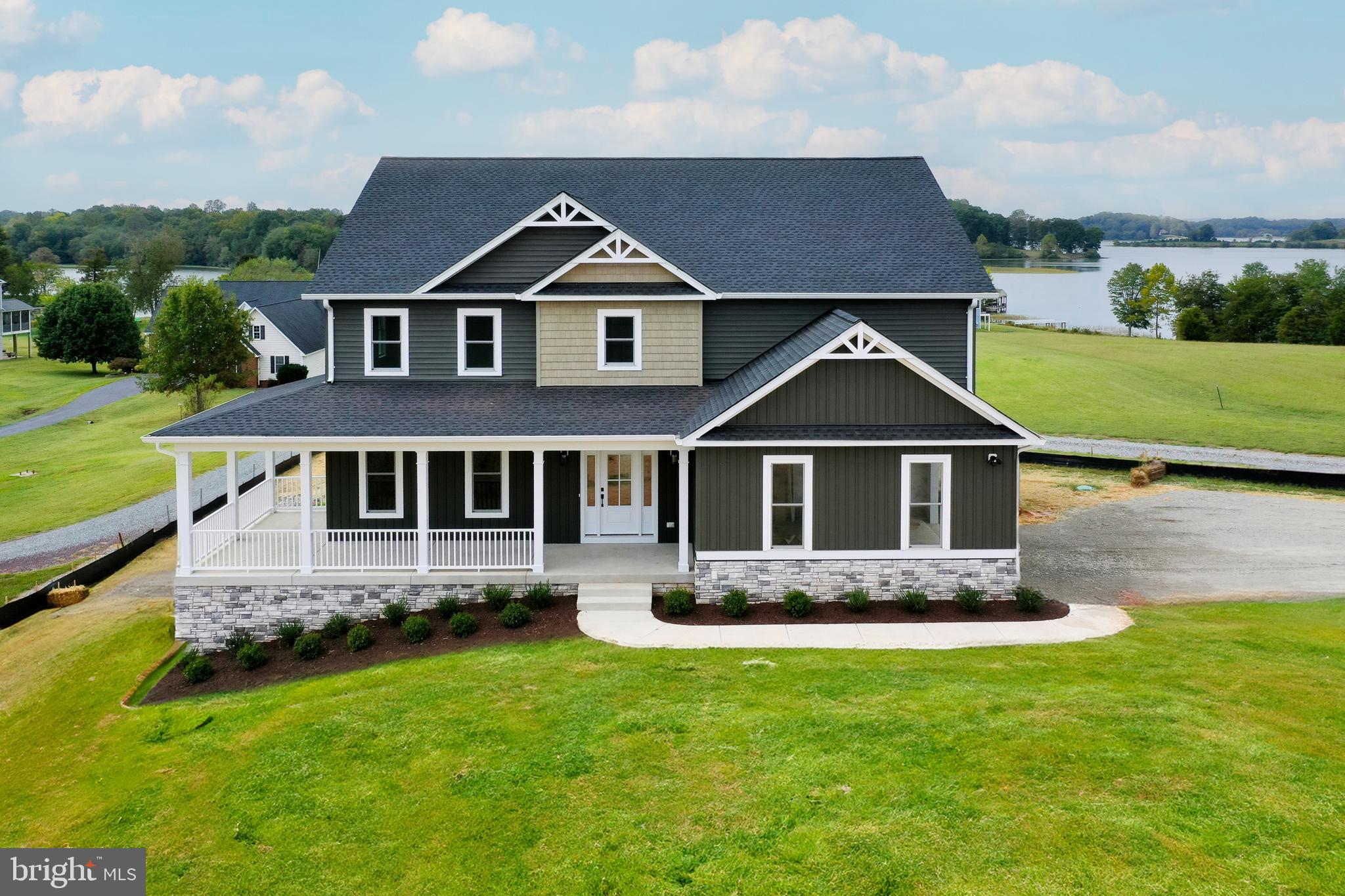 Move -In-Ready!  Brand New Waterfront Home at Lake Anna.  Welcome to this stunning, brand-new custom residence by award-winning Built Right Homes, located in the prestigious Georgetown Estates neighborhood—renowned for its upscale homes, breathtaking lake views, and unbeatable location.  Nestled on a quiet cul-de-sac, this 1.9-acre waterfront lot features a completed composite single-slip boat dock, making this home truly lake-ready!  Step inside to over 4,900 square feet of beautifully designed living space, perfect for entertaining or everyday living.  The expansive open floor plan includes 3 bedrooms, 2.5 bathrooms, and a private office that can easily serve as a 4th bedroom for added flexibility.  The gourmet kitchen showcases shaker-style cabinets, quartz countertops, stainless steel appliances, a farmhouse sink, and a large walk-in pantry.  Throughout the home, enjoy engineered hardwood floors, a gas fireplace with built-in shelving, Moen fixtures, and soft-close hardware.  The luxurious primary suite features a spacious walk-in closet, freestanding tub, tiled shower, and dual vanity.  Additional highlights include a tankless water heater, finished 2-car side-loading garage, and a full unfinished walkout basement with rough in plumbing, offering endless possibilities to customize your dream space.  Outdoor living is effortless with a covered front porch and multi-level covered rear decks, ideal for soaking in the lake views and enjoying fresh air.  Take a stroll or golf cart ride down to your private boat dock to explore endless lake adventures. Located just a 2-minute boat ride from The Boardwalk at Lake Anna, enjoy dining at Tim’s Restaurant, Moo-Thru Ice Cream, and mini golf.  Conveniently less than an hour to Richmond, Charlottesville, and Fredericksburg, and under 2 hours to Washington, D.C., this home offers the perfect blend of lakeside luxury and easy access to city amenities.  It's the perfect retreat! Boat dock is already built and the boat dock can be covered or a second level added. Dominion approval is in MLS documents!