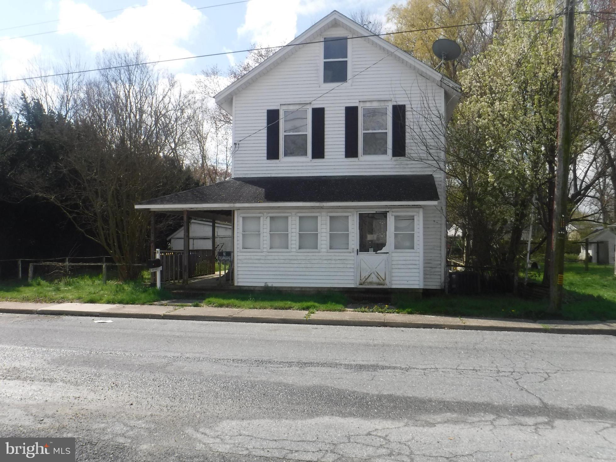 Major Price Reduction, . This oldie but a goodie  is located in the heart of Harrington. Just minutes from Harrington Raceway and Casino home of the Delaware State Fair Grounds. There are two older out buildings that can be taken down or rehabbed for a garage and/ or a  she shed  or man cave possibilities are endless. Wrap around porch just needs a rocking chair and glass of ice tea to take you back in time. Owner has done some of the work for you already with the kitchen lay out,  and HGTV painting throughout. Bathroom located down stairs off the kitchen and upstairs with access to the two large bedrooms. There is an upstairs attic if you dare climb the steps up to see what you can do up there. The porch area is enclosed for extra seating to read books, play games or just relax. The side yard has room for parking if you don't want to use the street and there is still plenty of room to plant a garden. Home is being sold "AS-IS" owner will make no repairs. Septic and well are not issue as it is all on the Town utilities system. Buy to rent or add a little bit more character and resell. This one has good bones! Waiting for the  next owner.