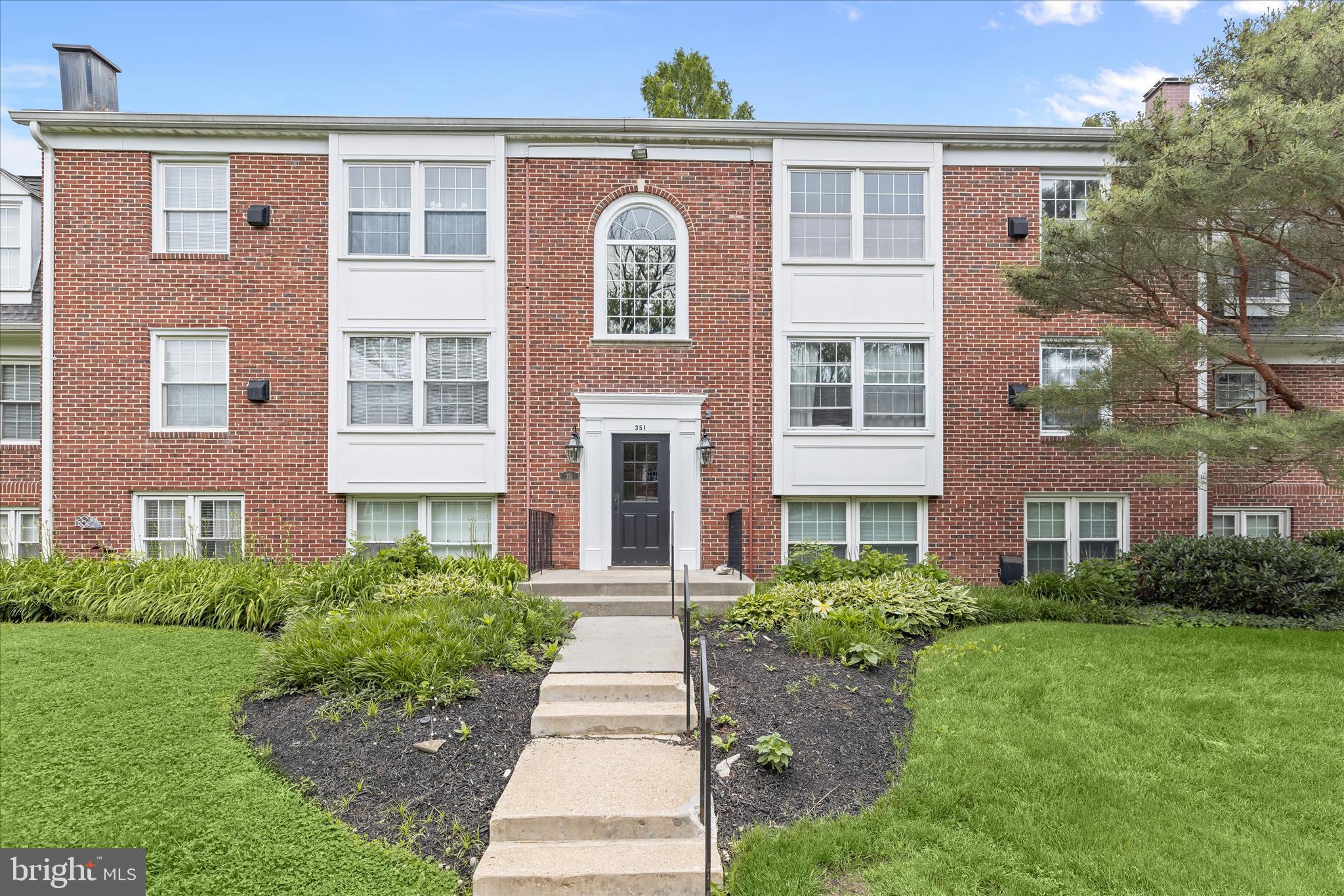 Enjoy the welcoming atmosphere of the sought-after Villages of Homeland community. A gated entrance leads through tree-lined streets, manicured lawns, and thoughtfully maintained landscaping. Unit 3D features the largest available floor plan in the community, offering an open layout with 2 bedrooms and 2 full baths. The sunny living room features wood-inspired laminate flooring and a ceiling fan, flowing easily into the dining area. Just beyond, the kitchen includes a gas range, custom decorative backsplash, built-in pantry, and double sink for easy meal preparation. Down the hall, the primary bedroom suite offers generous closet space with an organized storage system and a private full bath featuring attractive tile work and coordinating pendant lighting. A large second bedroom and full bath provide additional flexibility for guests, work, or everyday living. Laundry and private storage area located just off the unit.
Residents enjoy walking paths, Clubhouse with sauna, a community pool, and multiple EV charging stations, all in a convenient location near shopping, dining, Morgan State University, Loyola University Maryland, Notre Dame of Maryland University, and Johns Hopkins University, with easy access to I-695 and I-95.
Note:  Select interior photos have been virtually staged.