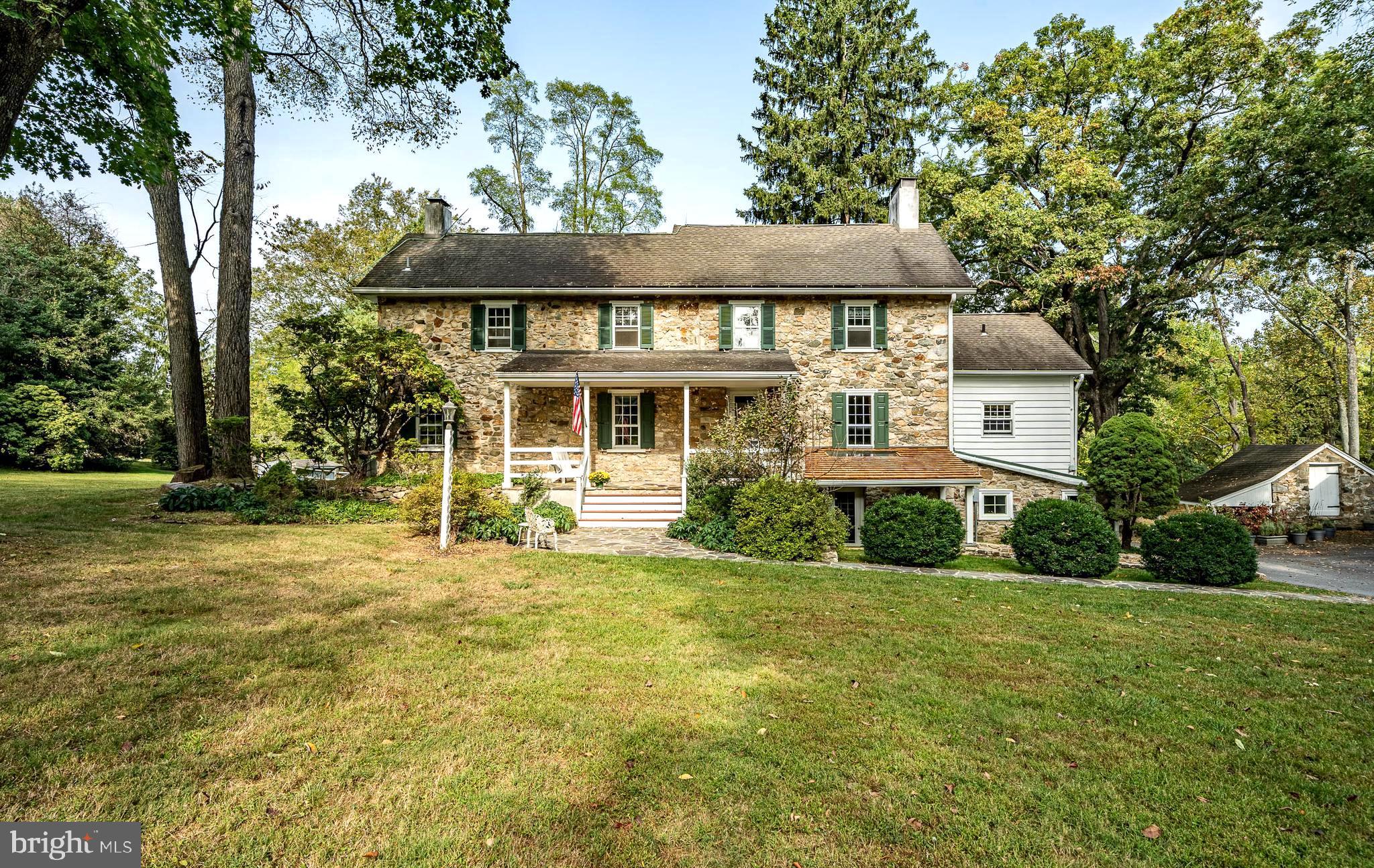 OPEN HOUSE CANCELLED! Welcome to 1121 Seven Oaks Rd in Chester Springs, a beautiful 4-bedroom, 3-bathroom home on 10 sprawling acres. This property, conserved with the French & Pickering Creeks Conservation Trust, is simply one of a kind. Discover the allure of serene, country living with this rare gem that offers a peaceful oasis, yet is just minutes away from shopping, dining, and major roadways! From the lush grounds to the inviting in-ground pool, take in the tranquil beauty of the surrounding farmland where every day feels like a getaway. Step into this charming Historic home, where timeless elegance meets comfort. There are stunning hardwood floors that flow throughout, setting the tone for a warm and inviting ambiance. The formal living room, part of the original early 1800s home, is a showstopper, featuring custom built-in shelves that frame a cozy fireplace, filling the space with character. Abundant natural light pours in, creating an airy feel perfect for relaxing or entertaining. The heart of the home is the eat-in kitchen, boasting a center island with countertop space and a built-in cooktop. A perfect cozy space for friends and family. The adjacent formal dining room, complete with its own fireplace, offers an ideal backdrop for holiday meals and special occasions. A spacious family room on the lower level exudes warmth with a wood stove and exposed beam ceilings, adding to the home’s unique charm. A tastefully designed half bathroom features a beautiful stone wall, and is conveniently located for family and guests alike. This floor also hosts a laundry area, streamlining household chores, and a versatile space perfect for a home office. Upstairs, the primary bedroom offers a peaceful sanctuary with its own fireplace and an updated ensuite bathroom. Two additional bedrooms on this level are well-appointed and share a hall bathroom. The top floor boasts a spacious loft area, which can be a fourth bedroom, playroom, home gym, or any space that suits your needs. Enjoy the serene outdoors from the bright and inviting screened porch, where you have breathtaking long views, and perhaps where you could catch a glimpse of your horses enjoying the pastures beyond. Another bonus of this property is the 2 bedroom, 1 bathroom with fireplace guest house attached to the barn! The guest house adds a private space for friends, family, or guests. The attached barn is ideal for your horses, animals, farm equipment, fun toys, and even makes a perfect space for a party! Take a seat outside and enjoy your private spring fed pond. The spring house located on the property services the guest house. There is another outdoor structure, a great space for any hobbyist. Additionally, there is a detached 3 car garage. This is an extraordinary opportunity  for anyone looking to combine privacy with convenience in the heart of Chester Springs! The current owners have been the stewards of this piece of history for the past 40 years. What a rare opportunity to be the next!