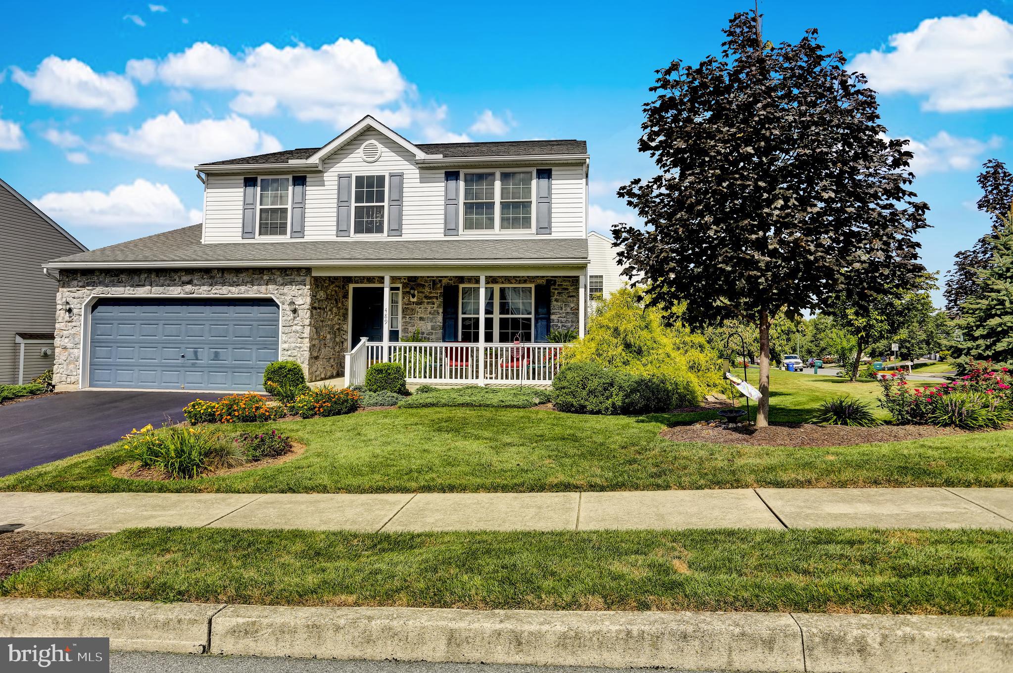 Are you looking for that "At Home" feeling? Then schedule your showing at 489 Mountain Blvd. This very comfortable , well maintained home with lovely views offers,  a flexible floor plan, a new large maintenance free Trex deck w/vinyl railing with a retractable awning , and a beautifully landscaped corner lot. Do you love a covered front porch? You will enjoy rocking away hours with friends and family with newly installed vinyl posts and railings. The foyer has hardwood, the front room can be a dining room or a formal living room. The kitchen, dining area and large family room are all in one large area, perfect for having family and friends over. You will appreciate the large pantry and half bath off the kitchen, plus the warm gas fireplace in the large family room. Upstairs there are two nice sized bedrooms with good closet space,ceiling fans have been installed, a second floor laundry and full bath. The roomy master suite is also on the second level with its own full bath and wait until you see the walk in closet! The closet is a shoe/purse or clothing collector's dream!! The basement is easy to finish, the owners had electric outlets already installed and there is a huge daylight window so lots of natural light will flow in. This home has plenty of closet and storage space, is very economical with low utility costs, all the appliances stay to save you money, and the outside comes with built in bird feeders, beautiful landscaping so you can just move in and enjoy your new home! Call today for your private showing, 1 year home warranty included.