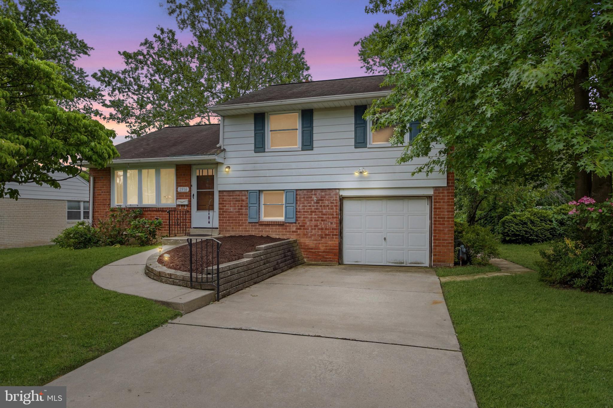 Welcome to 2916 Larkspur Lane, a charming expanded brick and siding single-family home set on a beautiful, large, flat lot along a quiet cul-de-sac street. This classic 3-bedroom, 1.5-bath home offers comfortable living spaces, great storage, and thoughtful updates throughout.

Inside, you’ll find hardwood flooring throughout much of the home and a spacious family room highlighted by a large bay window that fills the space with natural light. The adjacent dining room provides an easy flow for everyday living and entertaining, while the oversized eat-in kitchen offers plenty of room to gather. The kitchen addition has been insulated underneath and along the sides with R-30 insulation, adding comfort and efficiency.

Upstairs are three nicely sized bedrooms and a full hall bath. A walk-up attic provides an impressive amount of storage and offers potential for future finished space. The finished basement adds even more flexible living area, with a separate utility room and laundry space.

Outside, the large, level yard provides plenty of space to play, garden, entertain, or simply relax. A concrete patio with a Sunsetter awning creates a comfortable outdoor area to enjoy meals, shade, and time outdoors.

Additional highlights include a one-car garage, a generously sized driveway, central air installed in 2020, and a copper water line replaced to the curb. Conveniently located near the YMCA, parks, and major highways, this home offers a wonderful blend of neighborhood charm, usable space, indoor comfort, and outdoor enjoyment.
