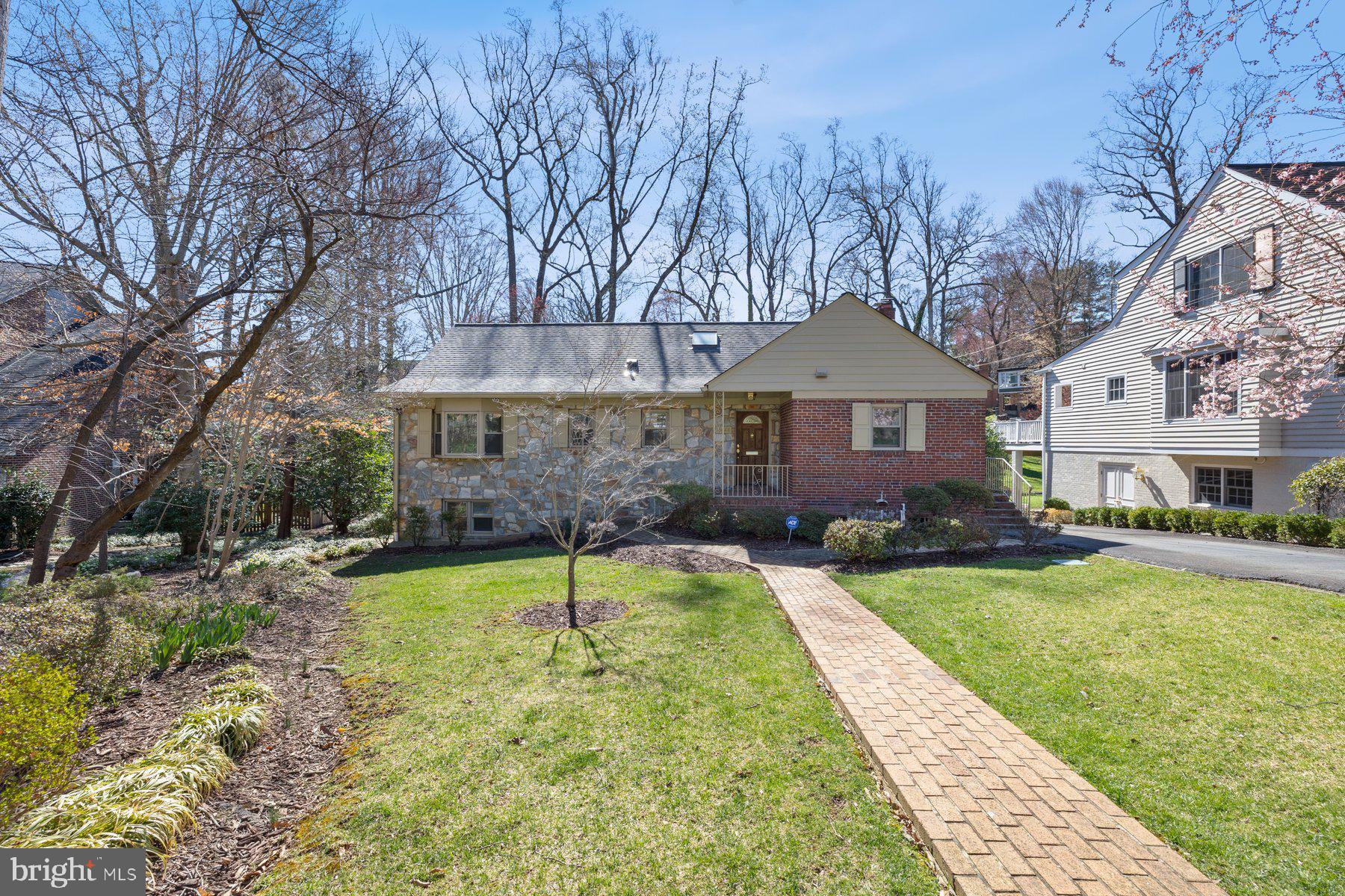 Welcome to 4444 38th Street North, a classic stone and brick-front rambler tucked away on a generous 10,627 sq ft lot in one of North Arlington’s most beloved neighborhoods. This 5-bedroom, 3-bathroom home offers an impressive 3,366 finished square feet of  living space, perfectly blending comfort, functionality, and a connection to nature.
Step inside the inviting entrance hall and immediately feel the warmth and livability of this home. To the right, you’ll find a spacious, table-space kitchen ideal for everyday living or gathering with friends. Just beyond the kitchen is a cozy family nook with a fireplace—sunny, welcoming, and perfect for everything from morning coffee to movie night. Flowing naturally from there is the formal dining room, which opens into an expansive living room/great room combo. This wonderful space is drenched in natural light from a full wall of windows that frame views of the lush backyard, complete with mature trees and a serene creek running through it. It's the kind of space that invites you to take a deep breath, relax and stay awhile.
Step outside onto the oversized deck—an entertainer’s dream and your own private perch overlooking the serene backyard. Whether it’s sipping iced tea in the afternoon sun or hosting weekend BBQs, this is where memories are made.
Back inside, the library with built-ins offers a quiet retreat for work or reading. Down the hall, you’ll find a comfortable primary bedroom with en-suite bath, along with two additional bedrooms—one currently configured as a home office—that share a hall bath.
Upstairs is a quiet home office and attic space offering excellent storage or the potential for future expansion—ideal for anyone looking to put their own stamp on the home.
The walk-out lower level is full of surprises, offering a second large family room with a charming wood-burning fireplace, two additional bedrooms, a full bathroom, and a spacious utility/storage room. The huge screened-in porch provides even more living space—imagine cozy fall evenings with string lights and warm drinks, or summertime lounging out of the sun.
With its solid bones, generous square footage, and intriguing layout, this home presents an incredible opportunity for those with vision to bring fresh ideas and make it their own. 
And it’s all set in a dream location: just moments from a plethora of parks including Gulf Branch Nature Center, Fort Ethan Allen Park, Donaldson Run plus the Madison Community Center, and more. Whether you’re into morning walks, weekend hikes, or playground afternoons, you’ll love how easily nature and community come together here. Let’s not forget that it’s served by Jamestown Elementary, Williamsburg Middle and Yorktown High. 
Commuters will appreciate being just two traffic lights from DC, making your morning drive or evening escape a breeze. Essentials and indulgences alike are minutes away—grab groceries at the Cherrydale Safeway or explore the beloved Lee Heights Shopping Center, home to Arrowine & Cheese, Child’s Play, Crisp & Juicy, and more. Need more choices? Ballston and Clarendon are just a short drive and head west less than 7 miles to Tyson’s. 
This is more than a house—it’s a lifestyle. A place where space meets charm, convenience meets community, and imagination meets opportunity.
The piano is negotiable. Property is being sold in "as is" condition.