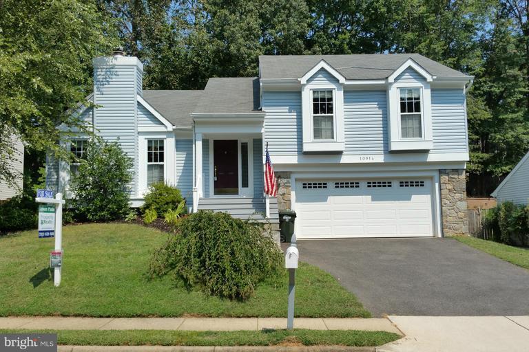 Beautiful home has curb appeal and almost maintenance free backyard.  Updated kitchen, bathrooms and windows.   Generally sized bedrooms.  Large living room with wood-burning fireplace.  Wonderful deck and walk-out basement with recreation room open to upgraded patio.  Two garage parking spaces.
