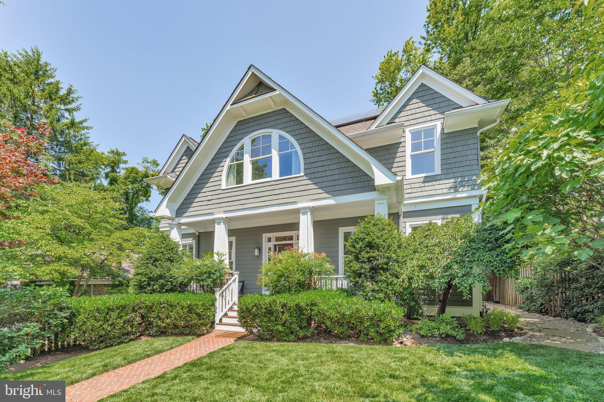 Nestled in the highly-desirable Huntington Terrace neighborhood of Bethesda, this impressive 6-bed, 4.5-bath home offers over 5100 sq ft of beautifully finished living space and charm. The main level features gleaming hardwood floors, recessed lighting, and elegant crown molding and trim throughout. The chef’s kitchen showcases custom wood cabinetry, granite countertops, stainless steel appliances—including a convection oven, Advantium microwave, gas cooktop, and a new dishwasher (2025)—and a sunlit breakfast area with serene views of the bucolic backyard. The inviting living room filled with natural light and enhanced by a wood-burning fireplace with a striking stone surround, which can be converted to gas if desired. An adjacent formal dining room offers the perfect setting for entertaining. A versatile study with French doors and built-in cabinetry, and a conveniently located powder room complete the main level. Upstairs, the spacious owner’s suite features trayed ceilings, two large walk-in closets with built-in shelving, and a luxurious en-suite bath with dual vanities, walk-in shower, soaking tub, and peaceful tree-lined views. Three additional generously sized bedrooms, each with hardwood floors and ample closet space, share a well-appointed hallway bath with a dual-sink vanity and tub/shower combo. Bedroom level laundry room, complete with utility sink and cabinetry, offers added storage and convenience. The top floor is dedicated to a private secondary suite, featuring a large bedroom with two closets and its own en-suite bath, ideal for guests or multi-generational living. The lower level is ideal for flexible living, featuring a large rec room with egress window, a separate exterior entrance, a spacious bedroom with an updated full bath, perfect for an in-law suite, au pair bedroom, gym, or potential basement rental opportunity. Enjoy the outdoors from the inviting front porch overlooking a beautifully manicured front yard, or relax in the fenced rear yard framed by mature trees, complete with a storage shed. Additional highlights include a new water heater (2025), no HOA, and a detached one-car garage with a shared driveway and additional parking pad, offering off-street parking for up to 4 cars. You’ll appreciate the fully owned 8.08 kW solar panel system, installed in 2022, which significantly lowers monthly electric bills. Ideally located just moments from NIH, Walter Reed, Medical Center Metro (Red Line), neighborhood parks, tennis courts, and the vibrant Downtown Bethesda, offering an array of shopping, dining, and entertainment options. Zoned for the highly sought-after Bradley Hills ES, Pyle MS, and Walt Whitman HS. Don’t miss this rare gem in a premier Bethesda location!