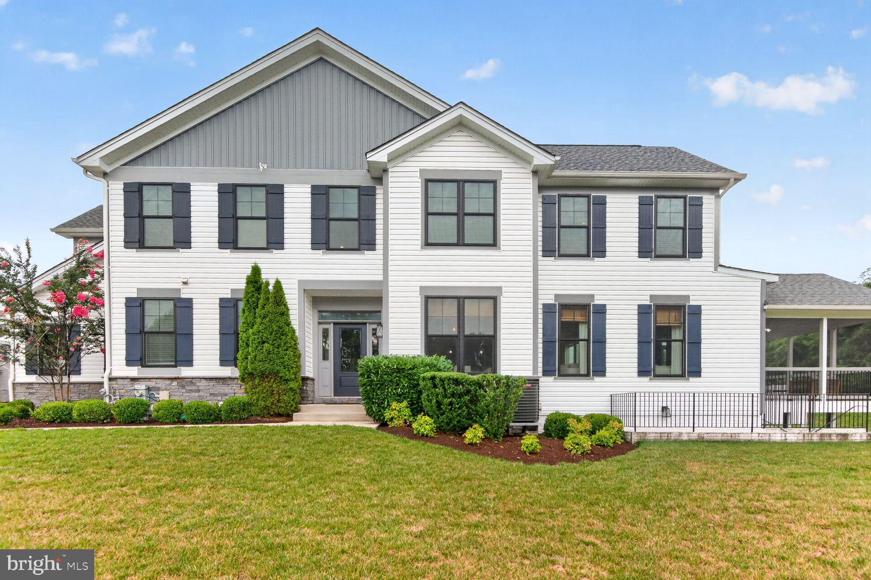 This beautifully maintained Toll Brothers Brookmere villa, built in 2020, is a must see. Nestled on a premium lot in the highly sought-after Arundel Forest community, this perfectly positioned home offers peaceful wooded views both behind and in front of the home. This exceptional residence is just minutes from shopping, dining, BWI airport, Fort Meade, and major commuter routes.

Freshly painted throughout and featuring engineered wood flooring and brand-new carpet, this home is truly move-in ready.

The heart of the home is an open-concept kitchen featuring quartz countertops, stainless steel appliances, Timberlake cabinetry, and a large center island that flows seamlessly into the spacious living and dining areas—ideal for both everyday living and entertaining.

Upstairs includes four bedrooms and two full baths, including the spacious primary suite which features an oversized dual-head shower and a generous walk-in closet outfitted with a custom Closet America organization system. The finished lower level provides exceptional versatility with a large recreation room centered around a cozy electric fireplace, a beautifully designed custom wet bar with built-in cabinetry, a full bathroom, and a separate flex room perfect for a home office, fitness room, or playroom.

Relax year-round in the screened-in porch while enjoying the tranquil wooded backdrop and the privacy of this end-unit villa.

Additional highlights include a two-car garage equipped with an EV charging port.

Residents of Arundel Forest enjoy outstanding community amenities, including a clubhouse, swimming pool, fitness center, playgrounds, walking trails, and beautifully maintained common areas.