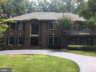 Wonderful Great Falls oasis on five acres tucked away in the cool shade of mature trees, complete with gorgeous in-ground pool and an abundance of outdoor living spaces.   Spacious foyer leads to elegant formal living room on the left and large private office on the right.  Continue in to the lovely formal dining room, spacious kitchen with granite breakfast bar, table space, and stainless steel appliances, then to the soaring family room with fireplace.  There is also a powder room on this level.  Upstairs, a landing on the bedroom level overlooks the family room and kitchen.  Four full bathrooms and sizeable bedrooms round out the upper level.  Laundry on bedroom level for convenience.  Downstairs is a fully finished basement with bar, a fifth full bedroom and full bath perfect for guests, and large area great for gaming or recreation.  Walk up exit from basement for convenient access to pool and exterior areas. Safety surround, electonic pool cover, and three-car garage.