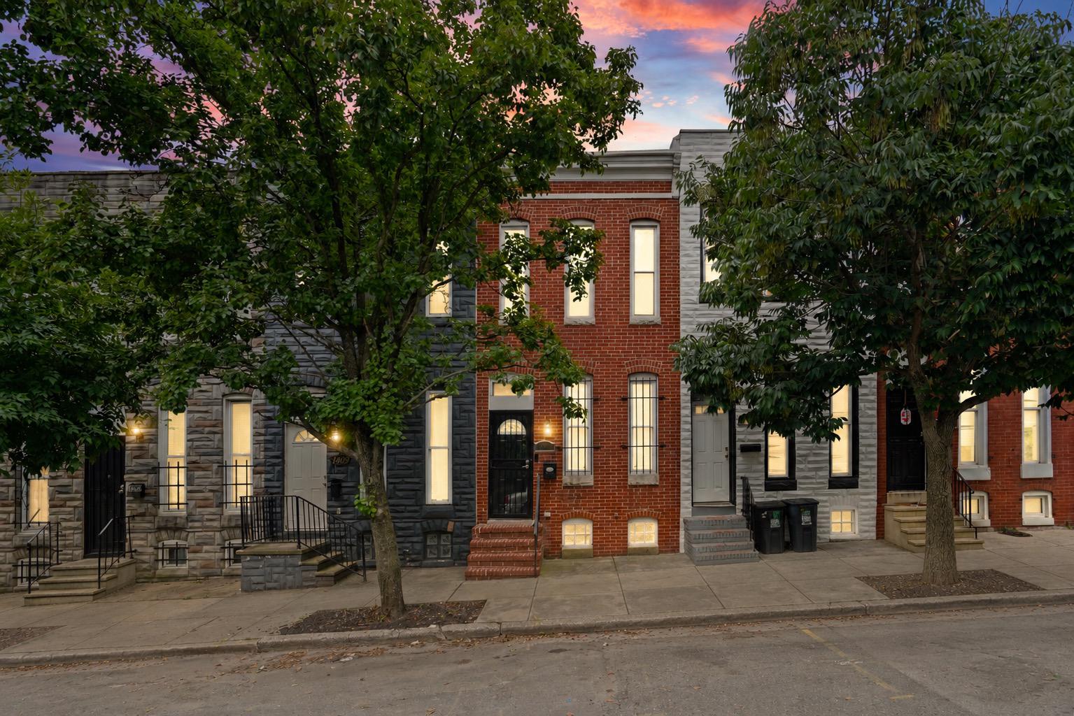 Welcome to 1411 W. Ostend Street, where modern finishes meet timeless Baltimore charm. Tucked away on a quiet dead end street with no homes directly across, this beautifully maintained three level row home offers the perfect blend of privacy, character, and convenience.

Step inside to an open concept main level showcasing exposed brick, Brazilian cherry hardwood floors, coffered ceilings, recessed lighting, and abundant natural light. The spacious living and dining areas flow seamlessly into the kitchen, complete with granite countertops, stainless steel appliances, and access to a private rear deck. An electric roll up security door provides added peace of mind while conveniently retracting when you’re ready to enjoy the outdoor space. A main level powder room adds extra convenience for guests.

Upstairs, the exposed brick continues into the spacious 1st bedroom. The 2nd bedroom has a private deck that creates the perfect place to enjoy your morning coffee or unwind after a long day. Three finished levels provide plenty of flexible living space for today’s lifestyle.

Conveniently located near many of Baltimore’s premier attractions, you’ll be just minutes from M&T Bank Stadium, Oriole Park at Camden Yards, the Inner Harbor, the National Aquarium, and BWI Airport. Commuters will appreciate easy access to Washington, DC, with The Wharf, Navy Yard, and Audi Field just 40 minutes away in light traffic.

Schedule your private tour today and experience everything this exceptional home has to offer!