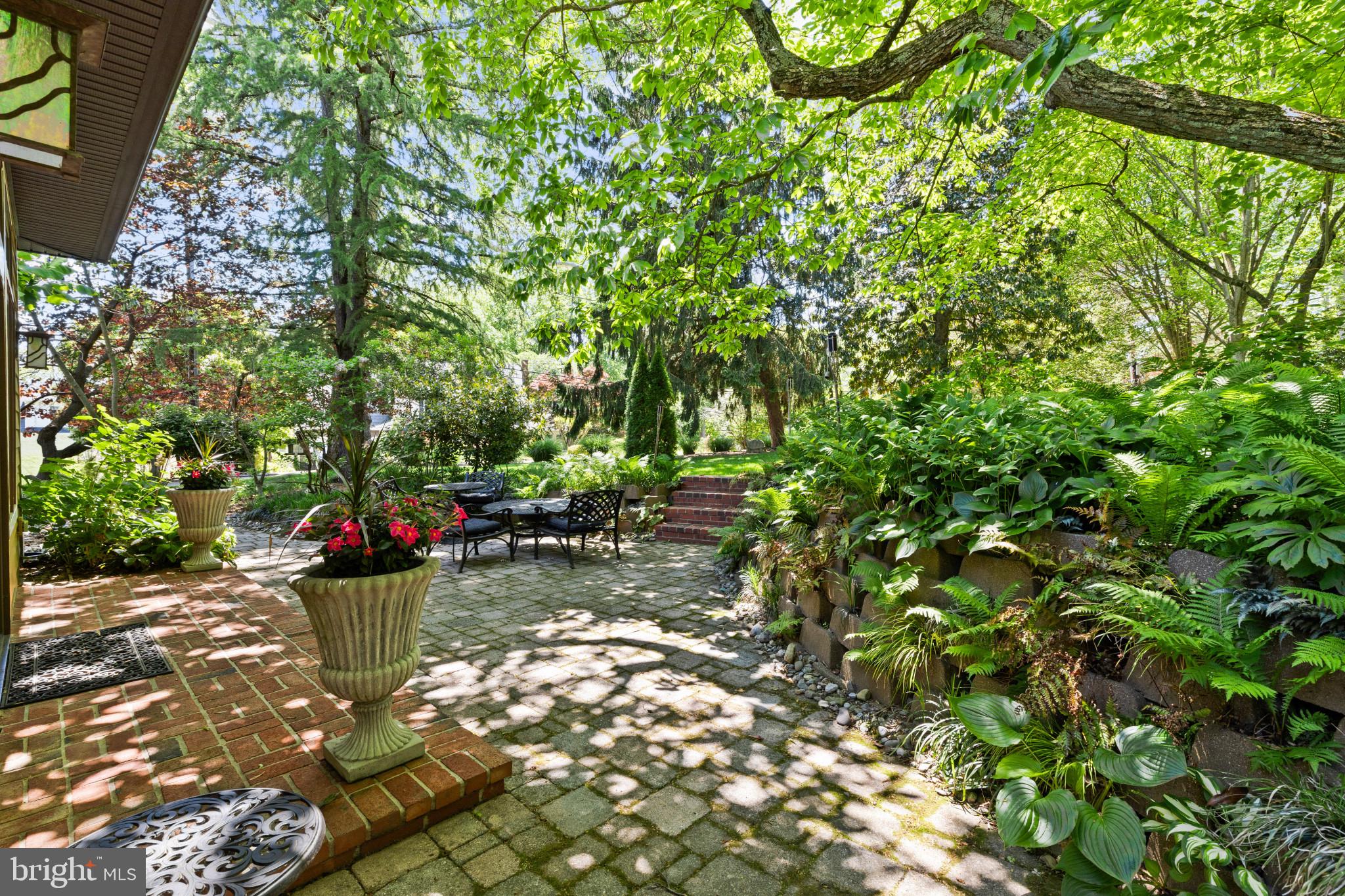 Tucked within the gated waterfront community of Epping Forest, this charming Craftsman bungalow captures the ease and appeal of Annapolis waterfront living with the rare advantage of true one-level living. Perfectly positioned on one of the community’s largest and flattest lots, the property offers a difficult-to-find combination of privacy, outdoor space, and low-maintenance comfort just moments from the Severn River and downtown Annapolis.

Inside, the three-bedroom, two-bath residence is filled with warmth and character. Heated floors provide year-round comfort, while dual fireplaces, including one gas and one wood-burning, create inviting gathering spaces throughout the home. The sun-filled great room features transom windows, abundant natural light, and French doors that open seamlessly to the outdoor living areas, creating an effortless connection between indoors and out.

The surrounding grounds have been thoughtfully designed to embrace every season of Chesapeake Bay living. Mature landscaping, a dedicated vegetable garden, outdoor fireplace, cedar outdoor shower, and expansive patio create a setting equally suited for quiet mornings or entertaining after a day on the water. Seasonal winter views of the Severn River further enhance the property’s appeal and reinforce its connection to the waterfront lifestyle that defines Annapolis and Anne Arundel County.

Life in Epping Forest extends far beyond the home itself. Residents enjoy access to one of Annapolis’ most established and sought-after waterfront communities, complete with a private clubhouse with waterfront dining, deep-water marina, sandy beach, boat ramp, tennis courts, scenic walking trails, and a vibrant calendar of neighborhood events and clubs. The location also offers convenient access to downtown Annapolis, the U.S. Naval Academy, Washington, D.C., Baltimore, and major commuter routes.

This is a rare opportunity to own a turnkey home in one of Annapolis’ premier gated waterfront communities, where the Chesapeake Bay lifestyle is part of everyday living.

Epping Forest is a Special Tax District. Annual tax: $1,583.64. Community is governed by binding Rules and Regulations.