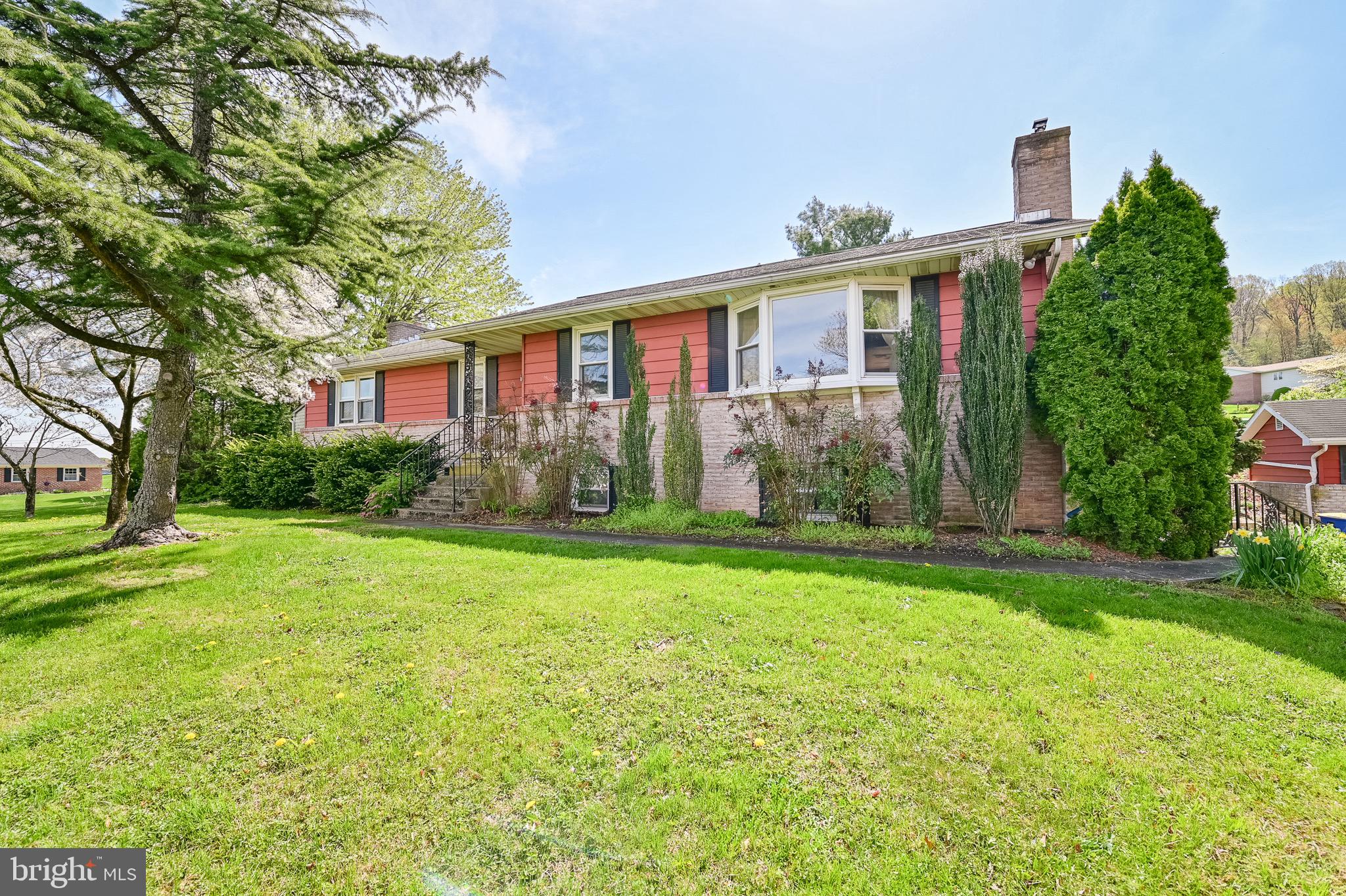 Snag this gem of a Ranch on 3/4 of an acre in New Holland! You will not lack space in this home! On the main level you will find a large living room, open to a formal dining room with beautiful wood flooring. The kitchen is a cook's dream: sizable with large island! Back the hall you will encounter the laundry room with entry to the back patio, three large bedrooms with ample closets, full bathroom, one primary bedroom with full primary bathroom attached, and pantry.  On the lower level there are two spacious storage spaces, a large office or den with working propane fireplace, one bedroom with a full bathroom across the hall and another large Rec room/family room with fireplace (closed off but able to be reopened). Outdoor features attached garage, two sheds, patio for entertaining and large lot! Schedule your showing today! ****THIS HOME IS OCCUPIED. DO NOT SEND CONTRACTORS TO PROVIDE QUOTES!