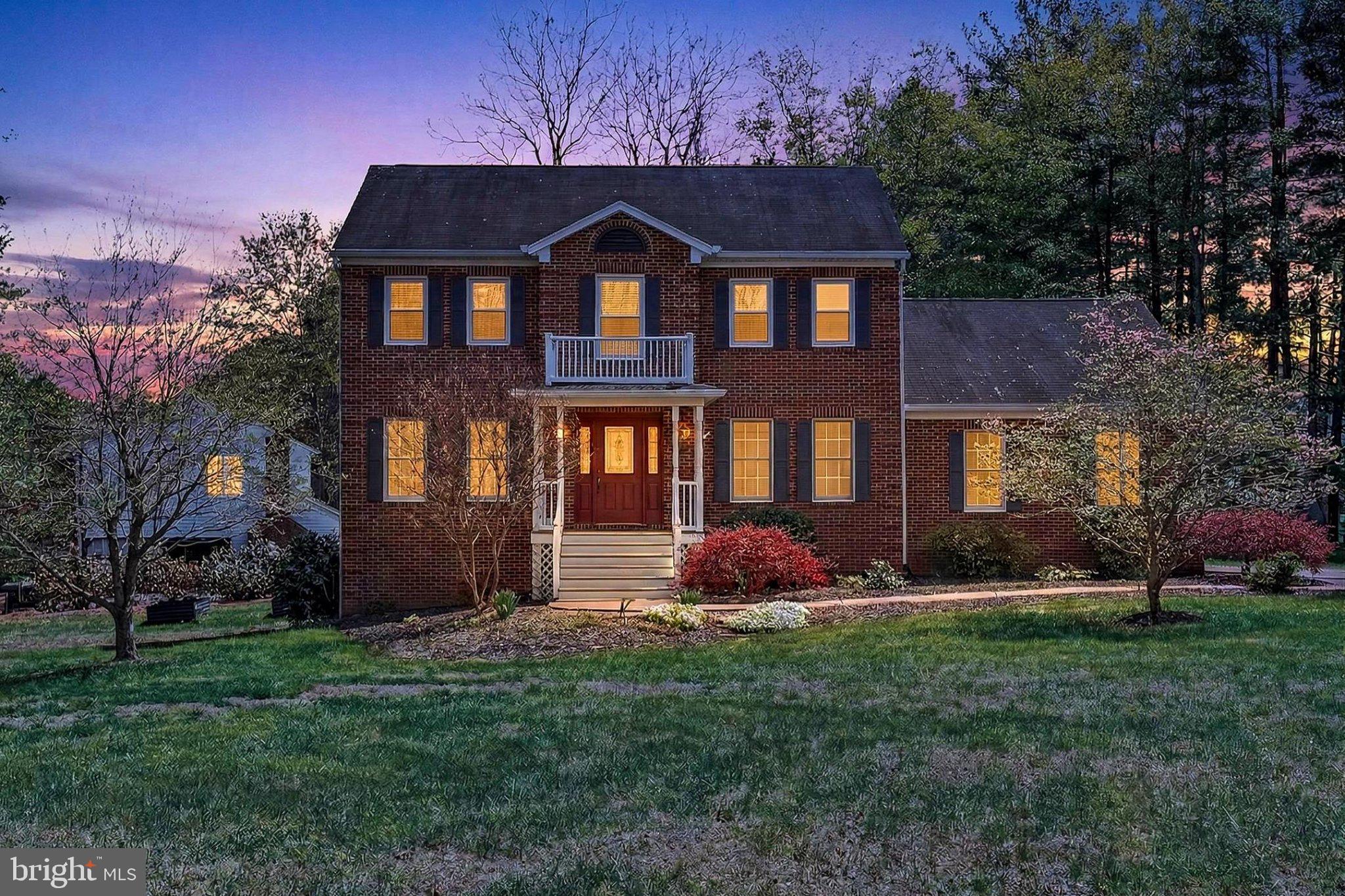 ** MOTIVATED SELLERS!! ** CHARMING COLONIAL ** More like a Warrenton address (1 mile from Kettle Run High School) ** Set on just over 1.5 acres in the Auburn Crossing neighborhood of Catlett, Virginia, this stately Colonial offers a refined blend of craftsmanship, comfort, and wooded tranquility in a sought-after setting. The home features 4 bedrooms and 2.5 baths, highlighted by a tailored exterior, a Georgian-style front entrance, a two-car side-loading garage, and a multi-area deck overlooking a vibrant lawn. Inside, rich hardwood floors, decorative moldings, designer paint, recessed lighting, a fireplace, and a thoughtfully designed gourmet kitchen contribute to a residence that balances elegance with everyday livability. Expansive windows invite natural light throughout, while well-defined spaces create a harmonious flow for both daily living and entertaining.

Warm hardwood flooring greets you in the foyer and continues into the formal dining room, where generous proportions accommodate large gatherings and an oil-rubbed statement chandelier provides a refined focal point. The formal living room offers an inviting space filled with natural light, ideal for welcoming guests or enjoying quiet conversation, and features refined detailing that complements the home’s classic style. The country kitchen impresses with handcrafted cabinetry, a designer backsplash, and high-end stainless steel appliances, including a dual-oven range. The adjoining breakfast area offers a comfortable space for casual dining and features a built-in planning center desk along with a glass door that opens to a wraparound deck overlooking a rolling lawn, a playset, a gardener’s shed, and mature trees, creating a seamless connection between indoor and outdoor living. The sunken family room provides a welcoming retreat centered around a cozy fireplace and flows into a stunning sunroom addition featuring marble tile flooring, a soaring cathedral ceiling, and French doors that lead to the deck. A dedicated den offers an ideal setting for a home office, while a powder room and a well-equipped laundry center enhance functionality on the main level.

Upstairs, the primary suite offers space for a sitting area, a walk-in closet, and an en suite bath with a dual-sink vanity with granite top, a glass-enclosed tub and shower, and spa-inspired tile finishes designed for relaxation. Three additional bedrooms, each bright and inviting with ceiling fans and generous closet space, share a beautifully appointed hall bath featuring a dual-sink vanity. The walkout lower level features a spacious recreation room with built-in storage, providing flexibility for games, media, or exercise. A utility area and additional storage solutions further enhance the home’s practicality. Updates include: New windows on upper level (2025), Refrigerator (2024), HVAC (2018).

This private retreat offers a peaceful atmosphere while maintaining convenient access to Routes 28 and 234, the Prince William Parkway, and the VRE. Nearby Manassas and Gainesville present a wide array of shopping and dining options, while outdoor destinations such as Prince William Forest Park provide opportunities to explore thousands of acres of natural beauty. Designed with enduring quality and timeless appeal, this exceptional property presents a lifestyle of comfort, space, and quiet sophistication. Welcome home!
