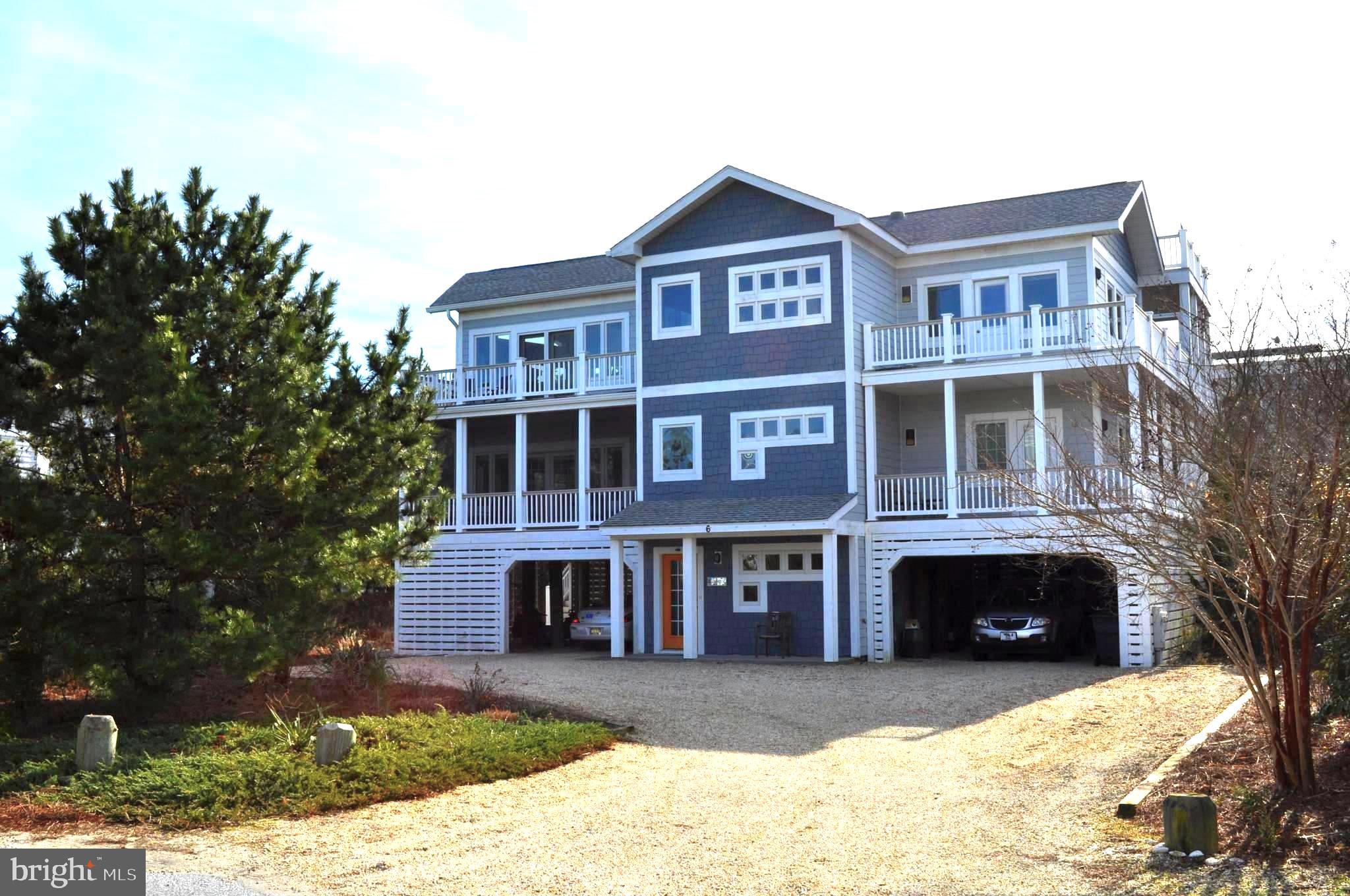 Introducing 6 Bedford Ave located in the exclusive private beach community of Indian Beach.  This home is situated one off the ocean front,  is bright and airy, with ocean views from  multiple areas of the house.  Built in 2014 by a local area builder this home features an inverted floor plan. On the first level you'll find the mechanical room which houses the Geothermal system, Rinnai hot water heater, and work shop. There's plenty of storage space here also and an elevator shaft that currently houses a dumbwaiter. Next is access to the under home parking garage, outside shower, and there is roughed in plumbing that could accommodate an additional bath if desired. 2nd level provides access to 4 Bedrooms and 3 Full Baths. Two of those bedrooms are owners suites with en suite bathrooms, one of which has a gas fireplace and access to a screened porch and wrap around balcony.  The laundry room is also located on the 2nd floor. The 3rd floor provides the great room with gas fireplace,  gourmet kitchen with granite counters, tile backsplash and lots of natural light with access to front and rear decks and ocean views. The deck on the South side of the great room has a location on the NE corner that features lovely ocean views, and was  constructed to support a hot tub, should one be desired.  Behind the kitchen is a large pantry, a full bath, and a sitting room with access to another screened porch, and an open deck with spiral staircase providing access to a roof top deck. Here you'll find plenty of room for sunbathing while enjoying gorgeous views of the ocean and bay. This is also the perfect place to enjoy your favorite beverage while watching Rehoboth Bay sunsets. 
The seller is a landscaper and there are many many plantings that will soon be returning to brighten the yard in Spring. You're sure to enjoy entertaining family and friends! A must see!