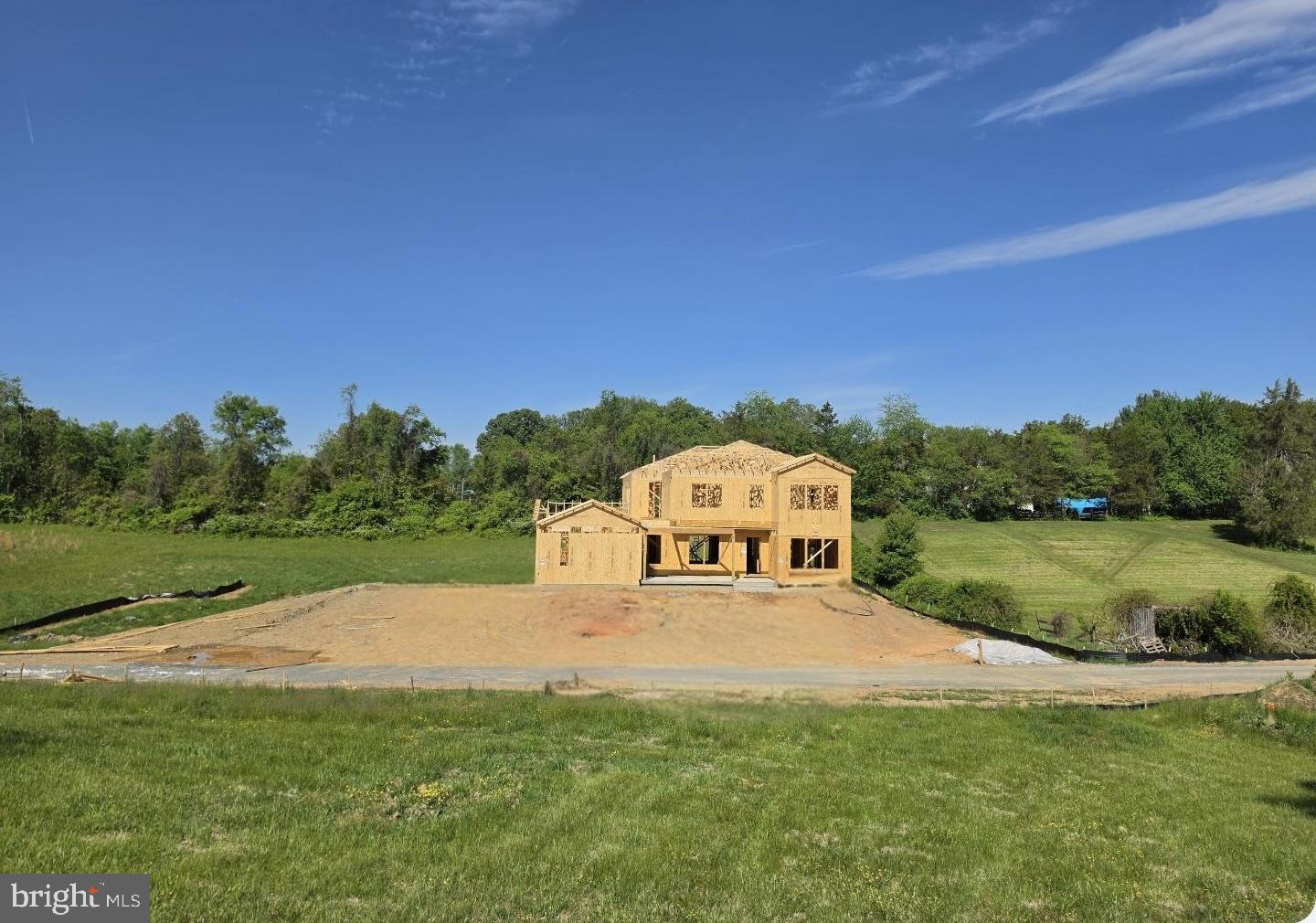 This home is To- be - Built Located in the highly sought after Colgan High School, Benton Middle, and Coles elementary  school district, this stunning to-be-built custom home offers privacy, luxury, and convenience, just minutes from shopping, dining, and everyday amenities. Perfectly positioned on a private road and set on a beautiful one-acre lot, this home will feature breathtaking natural surroundings and exceptional craftsmanship throughout.
    Spanning over 8,400 total square feet, including 7,185 finished square feet, this residence will showcase an impressive layout with 5 bedrooms, 7 full bathrooms, and 2 half bathrooms. Designed for comfort and flexibility, the home features two primary suites, one on the main level and one on the upper level, plus three additional bedrooms. The open-concept main level will be highlighted expansive living and dining areas, and a chef’s pantry ideal for meal prep and entertaining. A 3-car garage provides ample space for vehicles and storage.
Luxury features continue with a residential elevator, an optional theater room, and a fully finished lower level offering a recreation area, bedroom, and full bathroom. The home will also include a walk-up basement and an oversized walk-in pantry.
Outdoor living will be exceptional with a wraparound deck plus a private deck extending from the upper level primary suite.
The upper-level primary suite will offer a true retreat with a spacious sitting room, two walk-in closets, and a spa-inspired bathroom featuring a two-entry shower and a relaxing soaking tub. Large secondary bedrooms throughout the home provide comfort and flexibility for guests, family, or office use.
