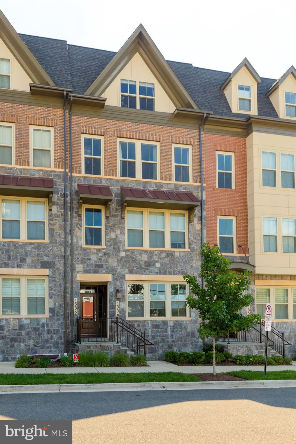 Stunning, like-new townhouse just minutes from Pentagon City, Clarendon and DC! Popular Washington model with a light-filled open layout, beautiful hardwood floors throughout all levels, an expansive rooftop terrace and attached garage! Gourmet kitchen featuring quartz countertops, a large island and stainless-steel appliances opening to both the living and dining rooms. Master suite with a luxurious master bath and dual walk-in closets. Two additional bedrooms, a full bath and bedroom level laundry complete this home. Only blocks to Metro & 1 block to elementary school!