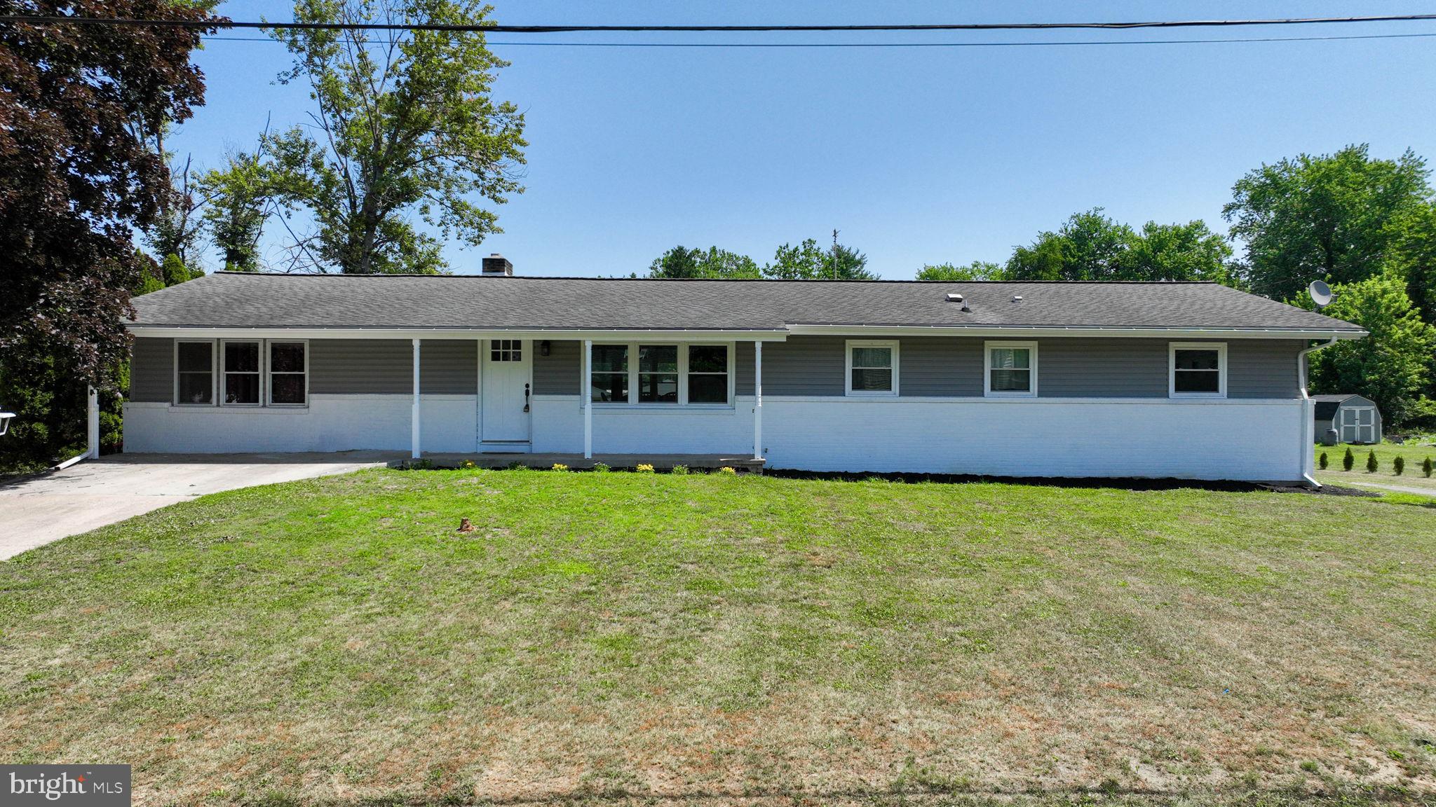 Welcome to 21 East Street! This 3 bed 2.5 bath boasts over 2,000 square feet of remodeled living space. Walk into the main living area and you will notice the refinished hardwood floors, recessed lighting, updated fans/light fixtures, and inviting fireplace. The open floorplan flows into the kitchen which has Shaker cabinets, tiled backsplash, stainless steel appliances, and a spacious pantry. The kitchen island has a butcher block countertop and seating for three! The master bedroom has an en-suite bathroom with a new vanity and shower. The bedrooms spacious and all have closets. The left side of the home could be a potential in-law quarters. Currently there is a family room and office. The 1st floor laundry room has new flooring and an attached half bathroom. The detached two car garage and basement allow for lots of storage and the garage could be perfect for a car lover, workshop, or just covered parking! The bones are great too with 2023 vinyl windows, 2023 HVAC system, 2024 central AC, 2025 mini-split in family room, 2023 hot water heater, and updated electrical/receptacles. Don't miss your opportunity to own this turnkey rancher on a .46 acre lot in Mount Holly Springs and schedule your showing today!