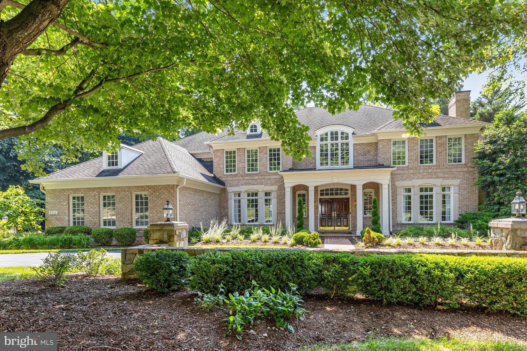 Welcome to this stately and elegant all-brick colonial, built by Gulick and nestled in the prestigious community of "The Reserve" in McLean. Offering 5 bedrooms, 5 full baths, and 1 half bath across more than 8000 square feet of living space.
Upon entering, you are greeted by a grand two-story foyer with a curved staircase, setting a dramatic tone for the formal living and dining rooms, both accented by arched entryways.  A sunlit conservatory and a two-story family room, enhanced by a gas fireplace and architectural columns, provide an abundance of natural light and elegance. The gourmet kitchen is a chef’s dream, featuring top-of-the-line appliances, a spacious breakfast area, a second staircase, and an adjoining sunroom for casual dining.
The expansive owner’s suite serves as a private retreat, complete with a cozy sitting area, two walk-in closets, and a spa-like bath with luxurious finishes. The fully finished walk-out lower level offers endless possibilities for entertainment and relaxation, with a large recreation room, a media room, an exercise area, and an additional bedroom with a shared full bath.
Outside, the meticulously landscaped grounds provide a peaceful setting for the private deck and patio —ideal for outdoor entertaining. The property also includes a 3-car garage and a circular paver driveway for added convenience and curb appeal.
Conveniently located in McLean with easy access to Tyson's, McLean Center, and Great Falls National Park and Village, this home offers the perfect blend of luxury, privacy, and prime location.