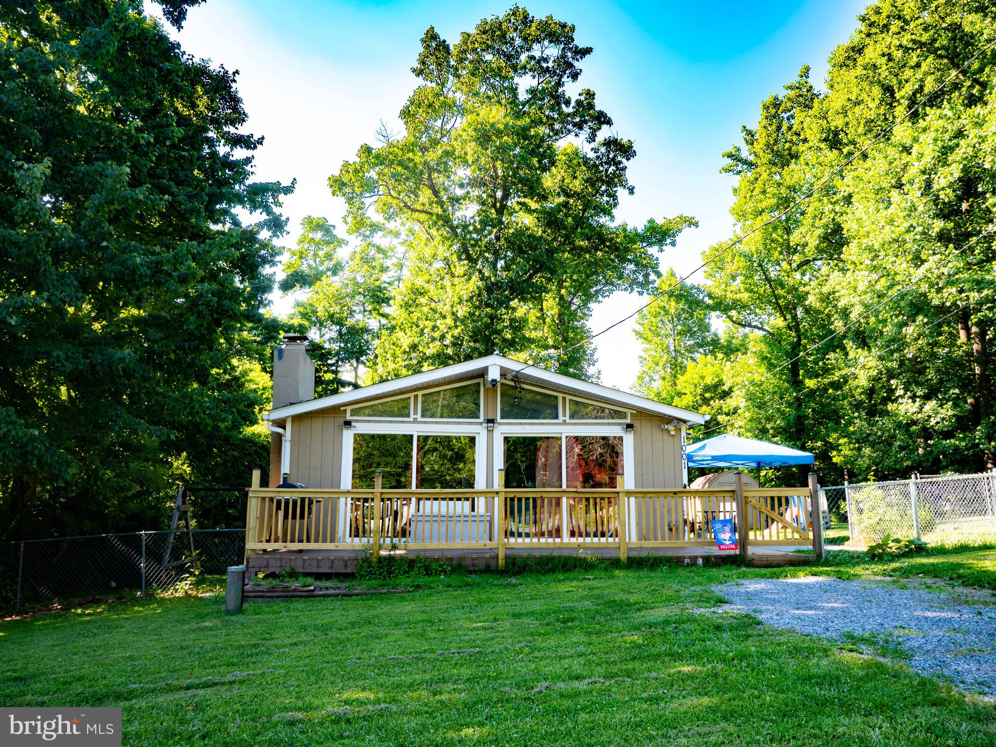 Welcome to this 2-bedroom, 1-bath home nestled on nearly half an acre in Linden. The inviting living room features a cozy fireplace, while the eat-in kitchen offers a comfortable space for everyday dining. Enjoy the peaceful setting from the front deck, and take advantage of the fully fenced backyard that backs to mature trees for added privacy. All kitchen appliances convey, making this home move-in ready.