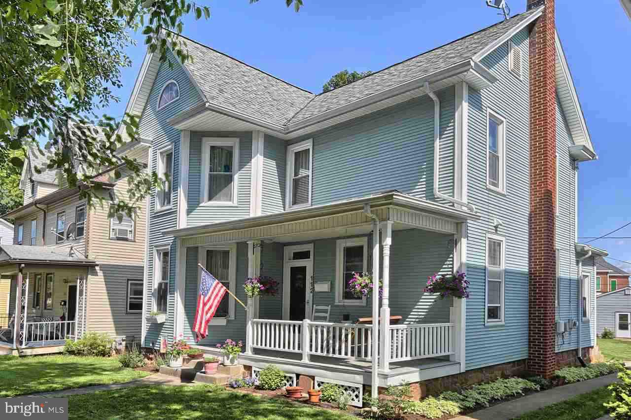 Charm & character are integrated beautifully with loads of updated amenities. Home has been completely rewired & replumbed. Replacement windows thru-out. New dream kitchen with birch cabinets, granite counter & Duraceram floors. Both bahts fully updated. Gorgeous staircase & original woodwork. Antique tin ceiling in dining room with pocket doors to living room. Lovely wood floors. 28 X 30 garage. Sweet front porch. 1 year home warranty. Delightfully warm & inviting home.